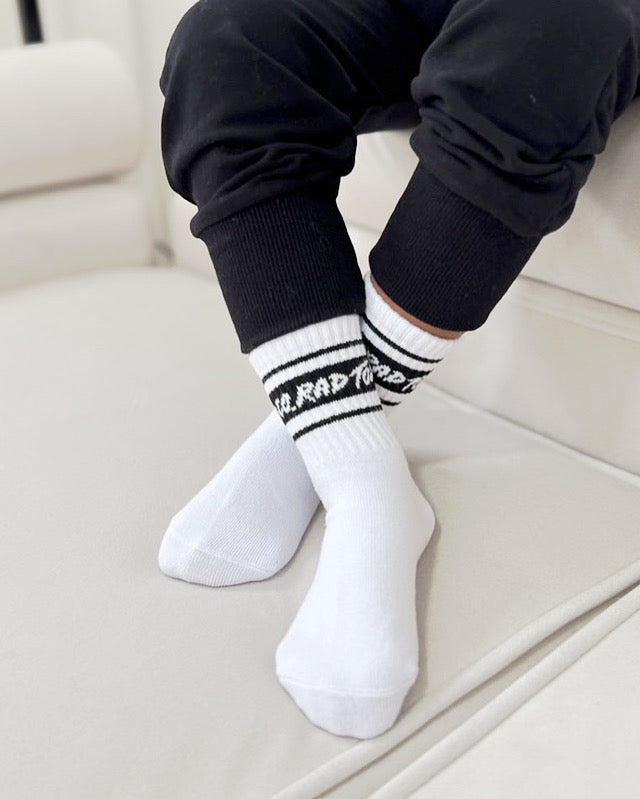 boy wearing white Trendy toddler socks. Looks comfortable!