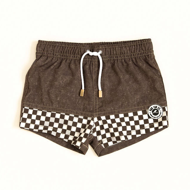 Brown shorts with a checkered pattern and a logo on a white background