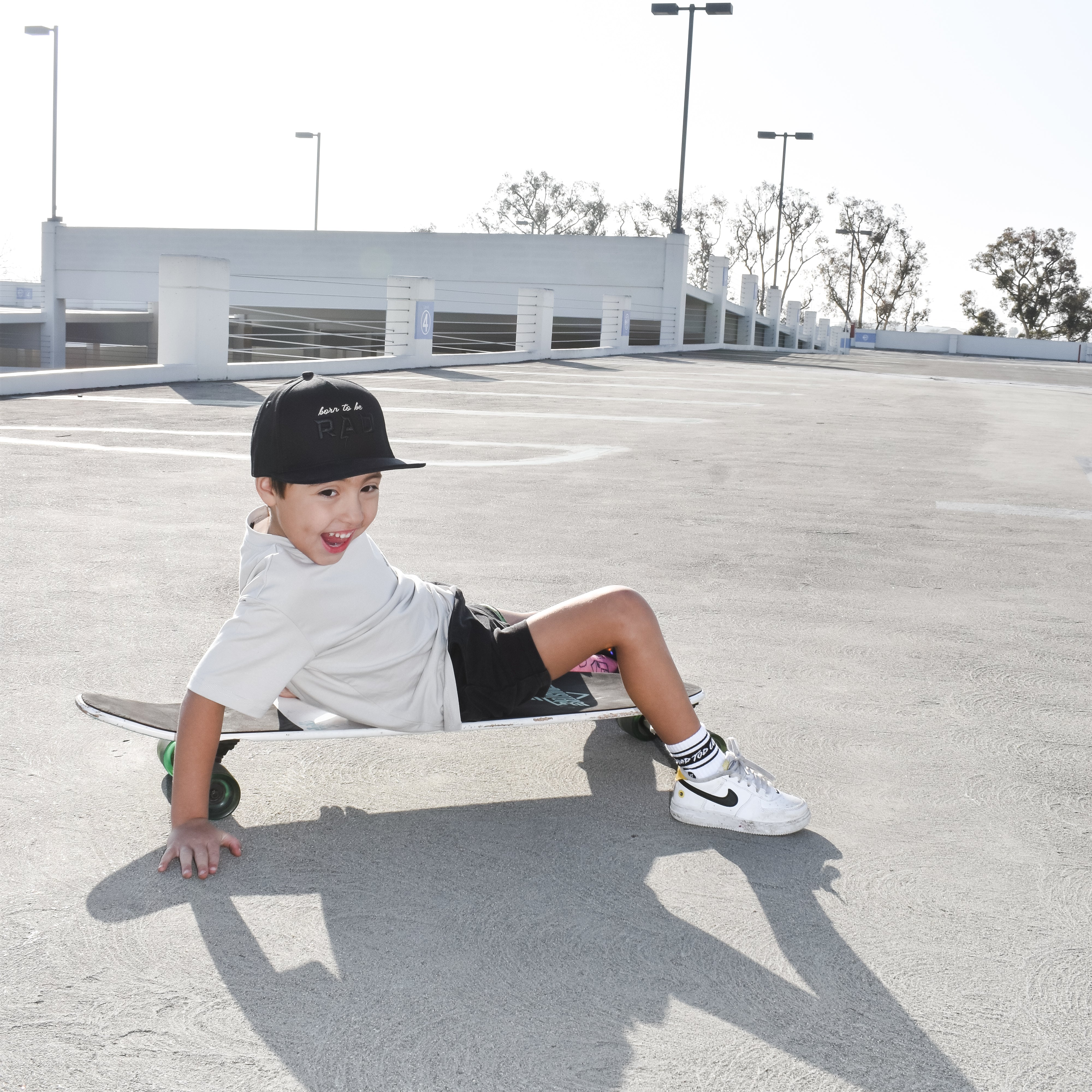 boy skating away wearing a Trendy toddler t-shirt with vibrant designs for comfortable everyday wear