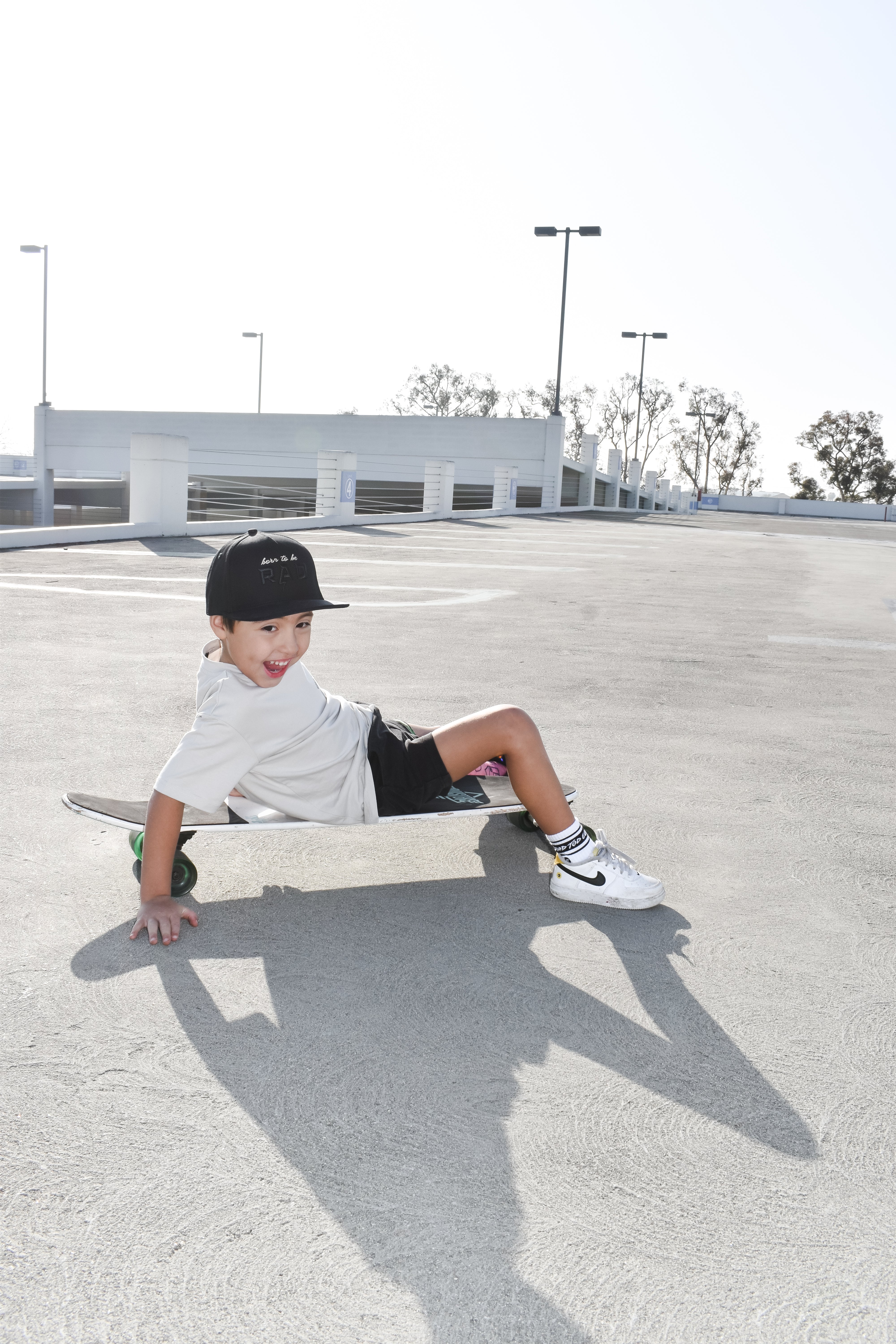 boy skating away wearing a Trendy toddler t-shirt with vibrant designs for comfortable everyday wear