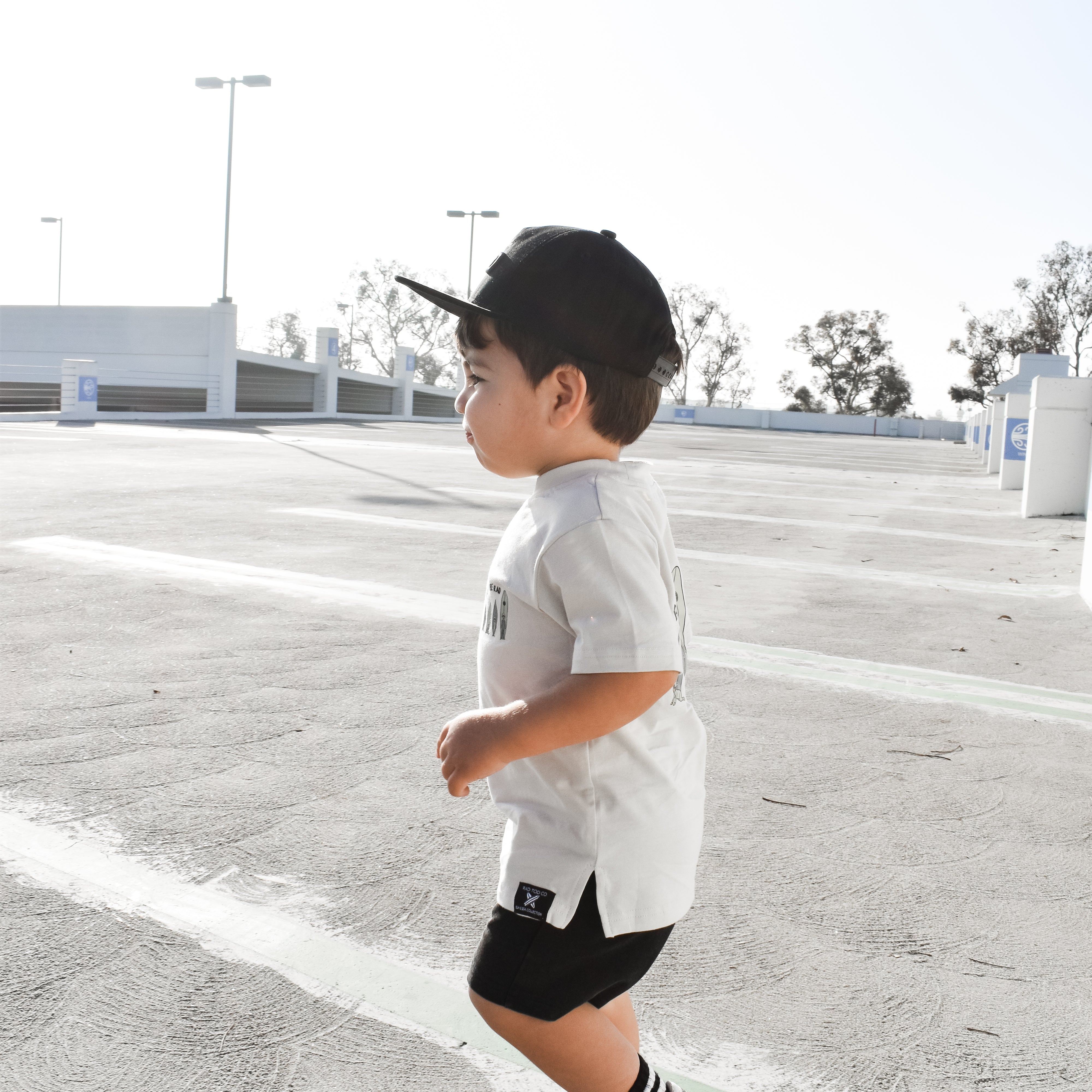 cool little dude wearing a Trendy toddler t-shirt with vibrant designs for comfortable everyday wear