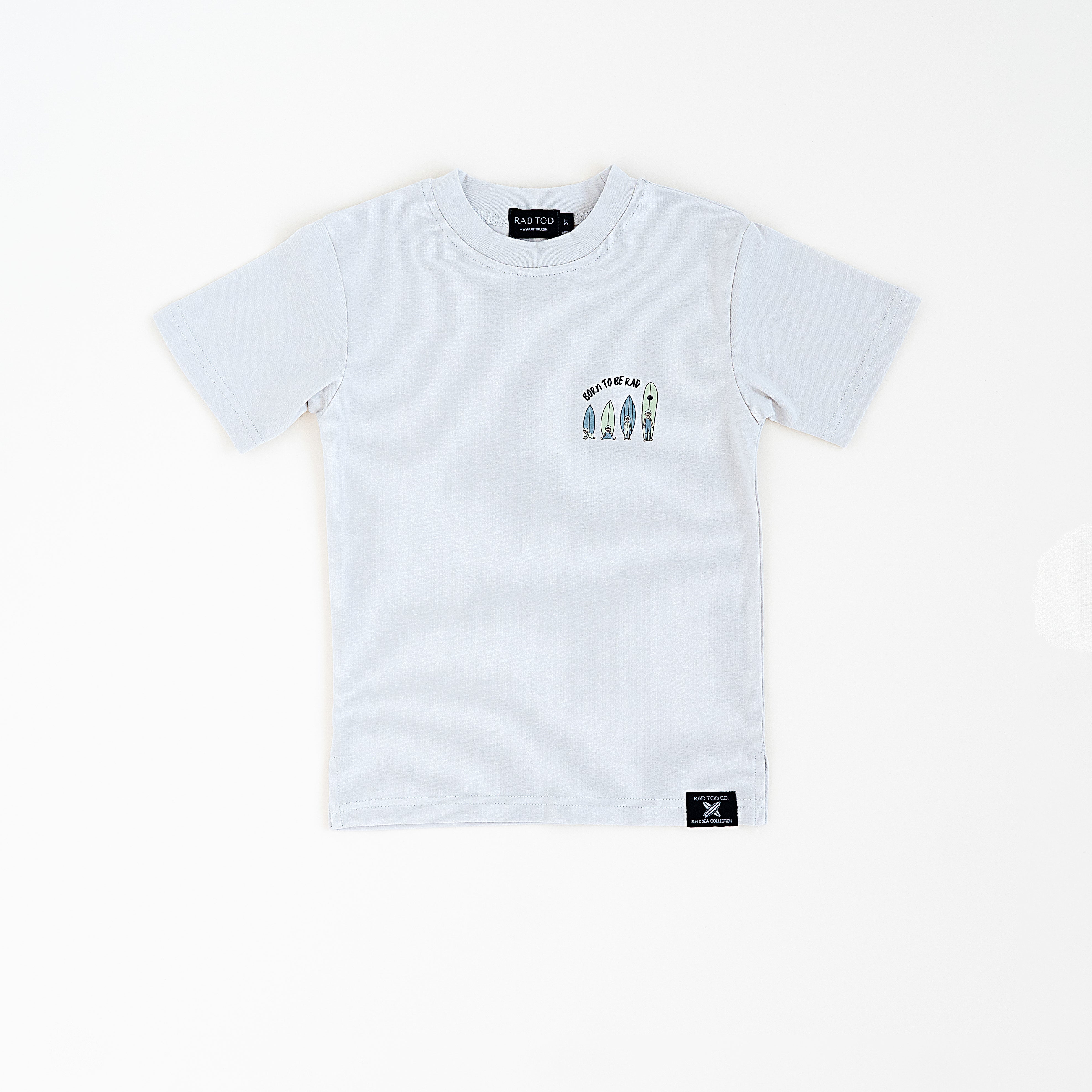 front side of a Trendy toddler t-shirt with vibrant designs for comfortable everyday wear that features a baby surfer growing up into a toddler