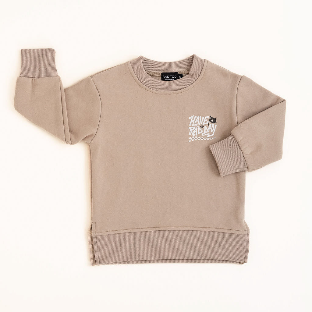 Kids beige graphic crewneck with playful white lettering and checkered design displayed on white background
