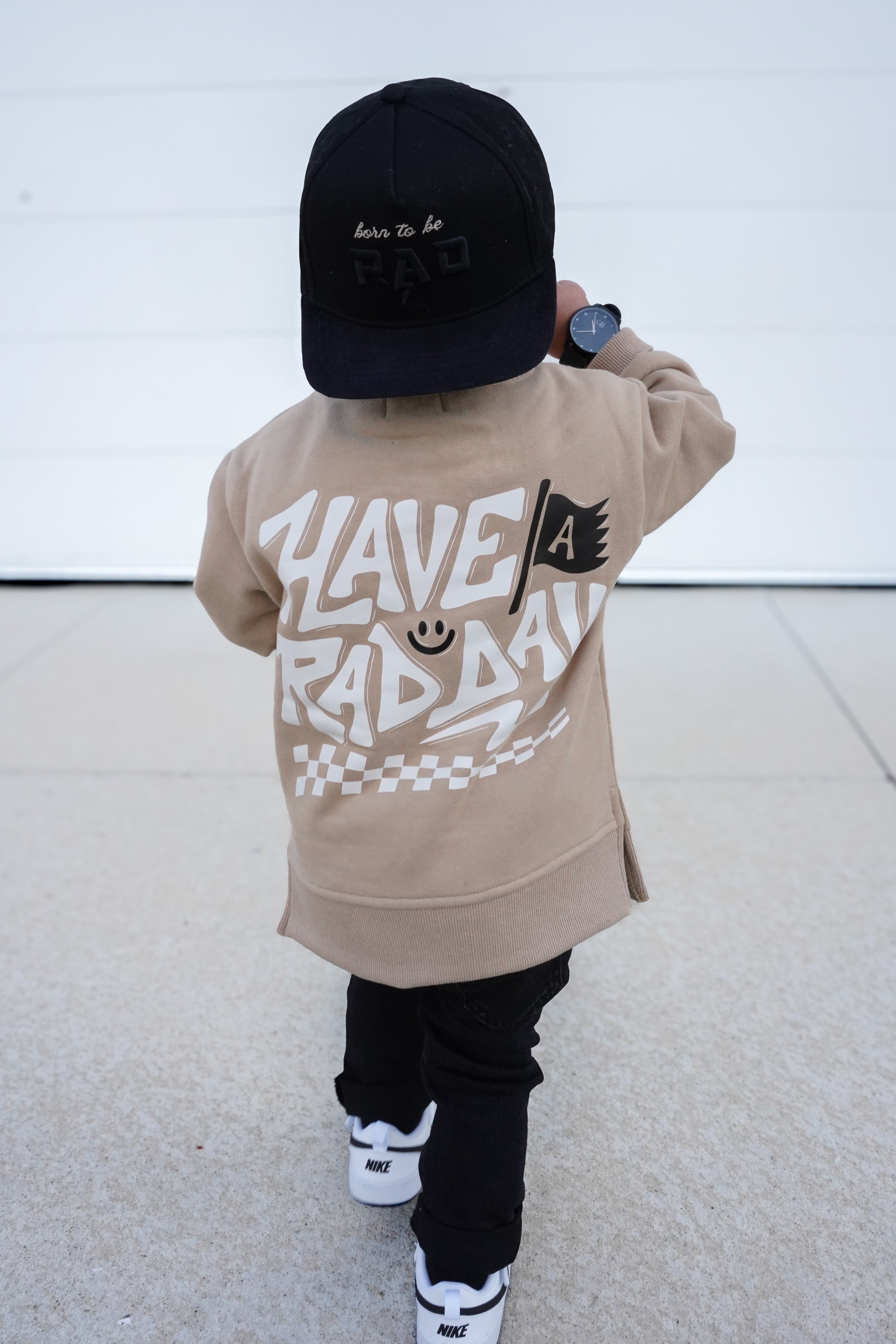 Beige kids crewneck styled casually with everyday outfit, featuring playful graphic details