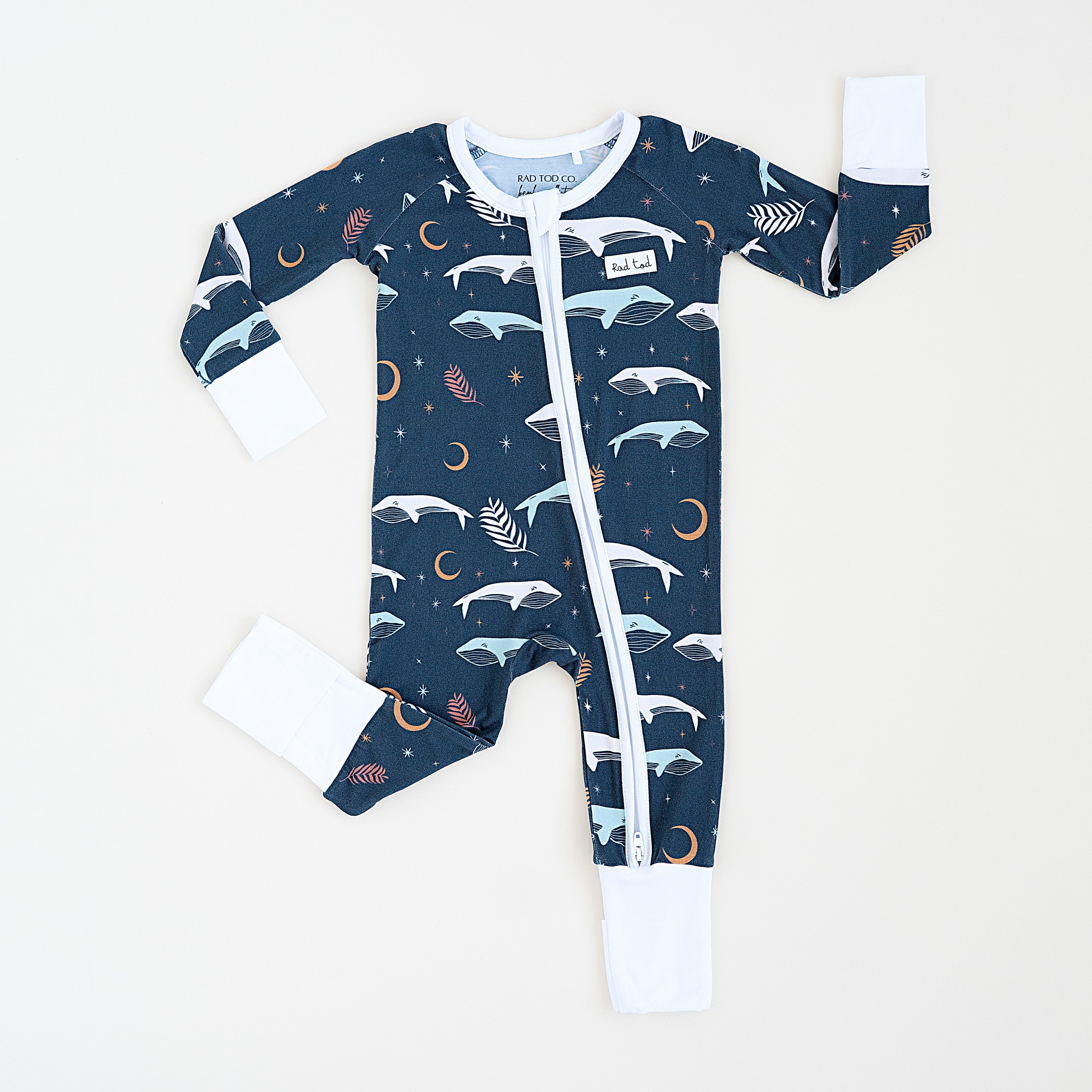 Luna Whale Bamboo Onesie featuring soft, breathable fabric, hypoallergenic properties, and a cute whale design for ultimate comfort and style.