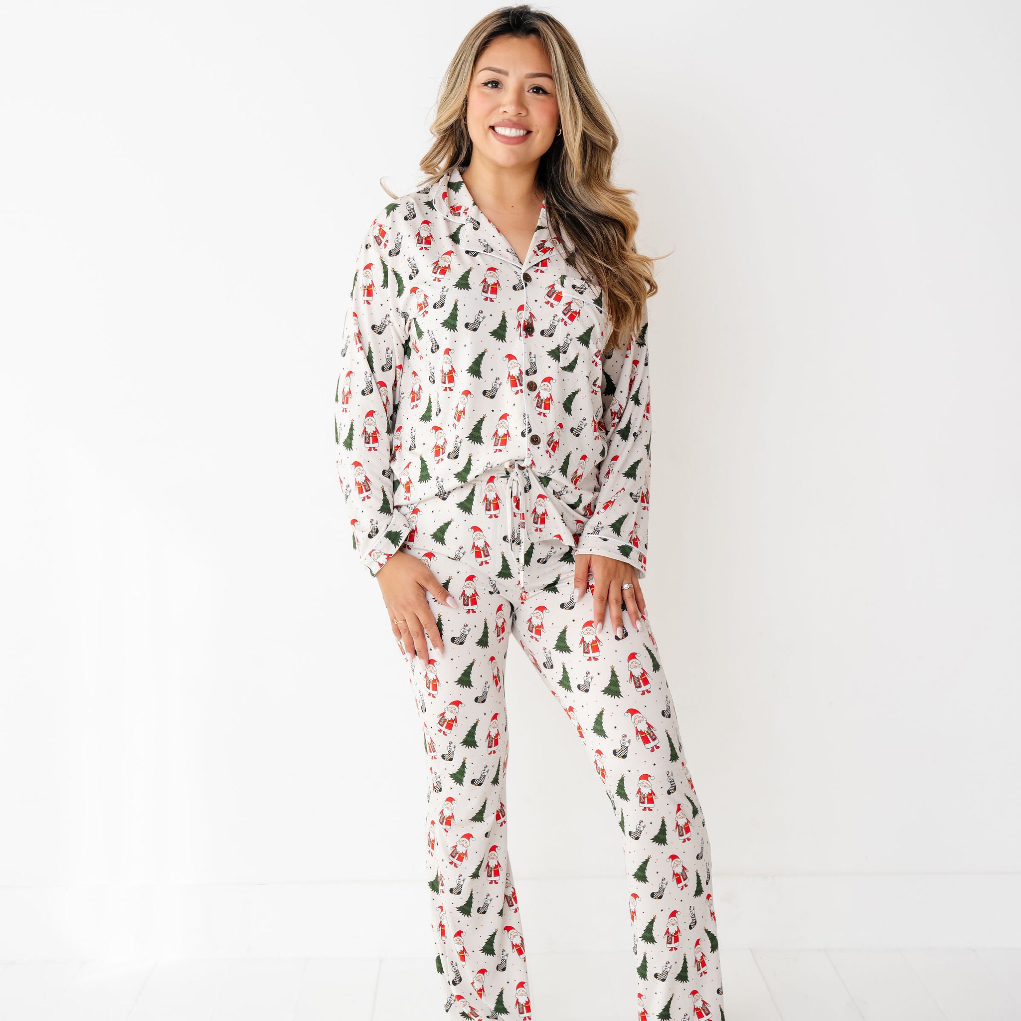 woman wearing RAD TODDLER Merry Everything Bamboo Christmas Pajamas with Santa, trees, and checkered stockings