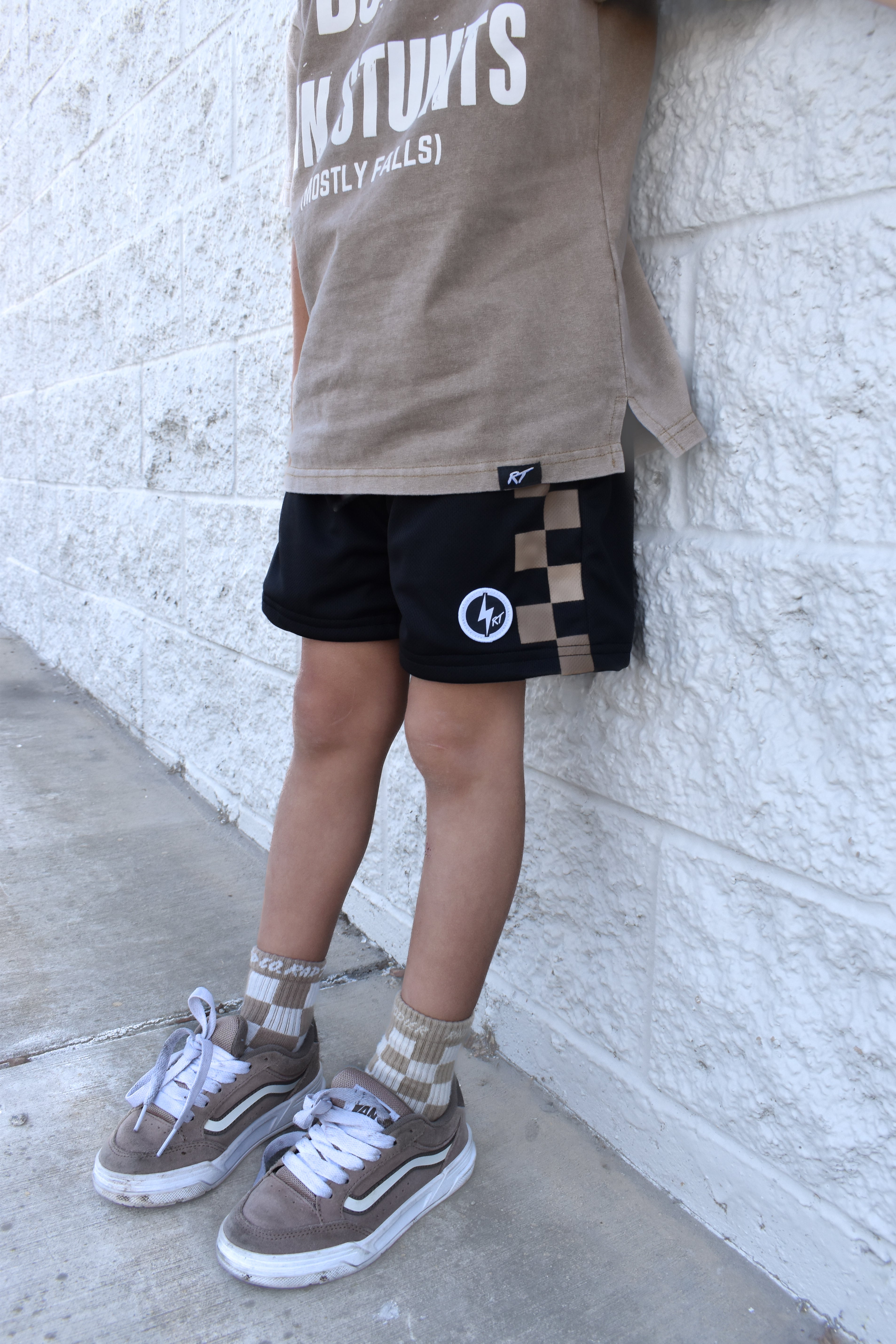 Black and sand check shorts with relaxed fit, lightweight polyester fabric, and everyday streetwear style
