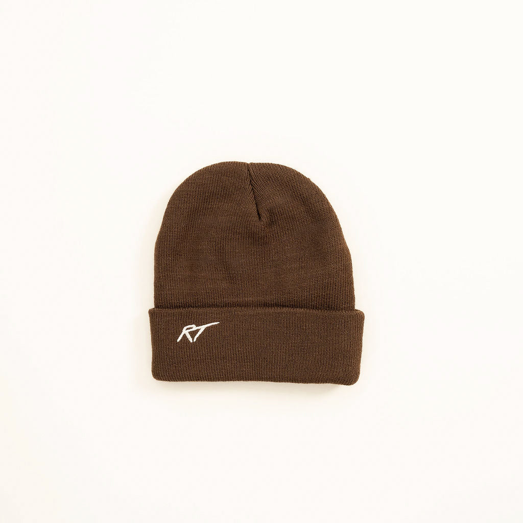 Flat lay of Chaos Club toddler beanie in brown knit, RT logo on back