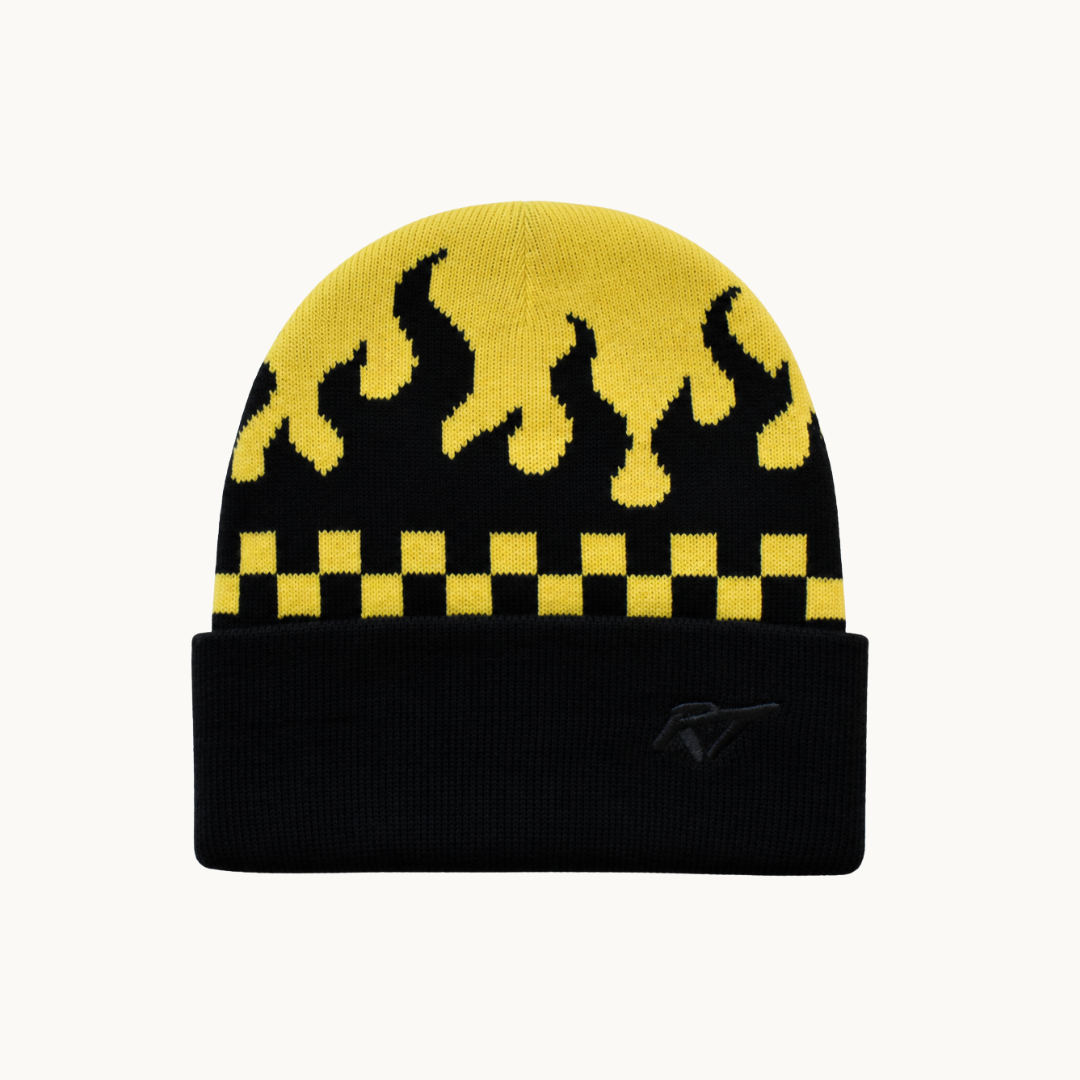 A black and yellow knit beanie hat featuring a flame pattern on the upper half, a yellow and black checkerboard stripe, and a solid black folded cuff with a small RT logo.