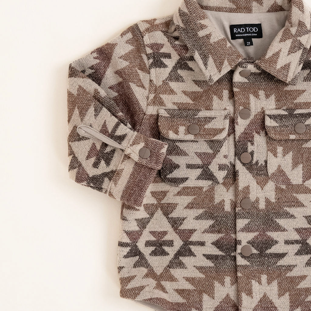 Flat lay of the Zion Jacket with earthy patterned design and soft lining