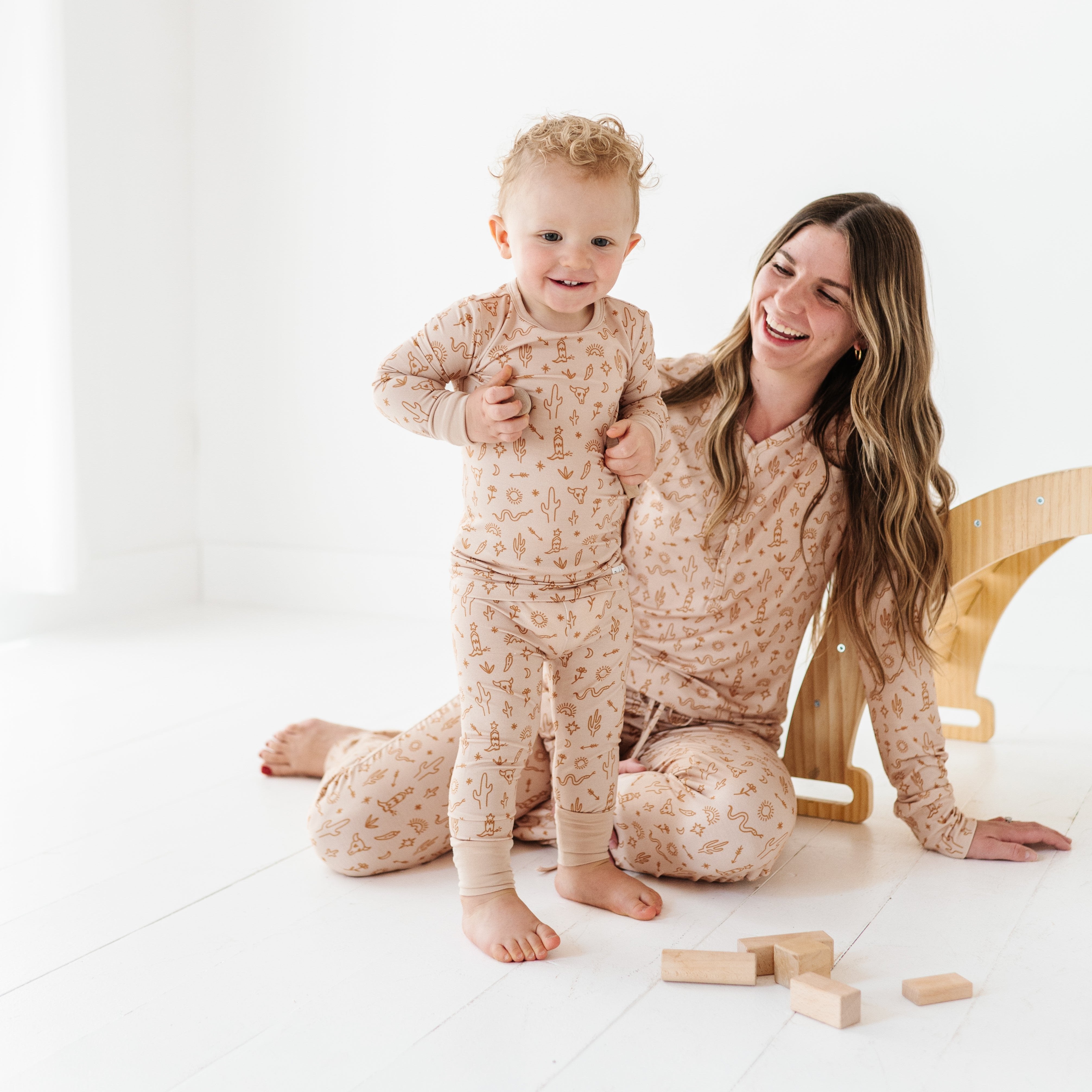 Women’s A Little Bit Country Bamboo Pajamas, designed by a mom, feature a desert-inspired design for ultimate comfort. Perfectly matching with your baby’s coordinating set for a stylish, cozy bedtime look.