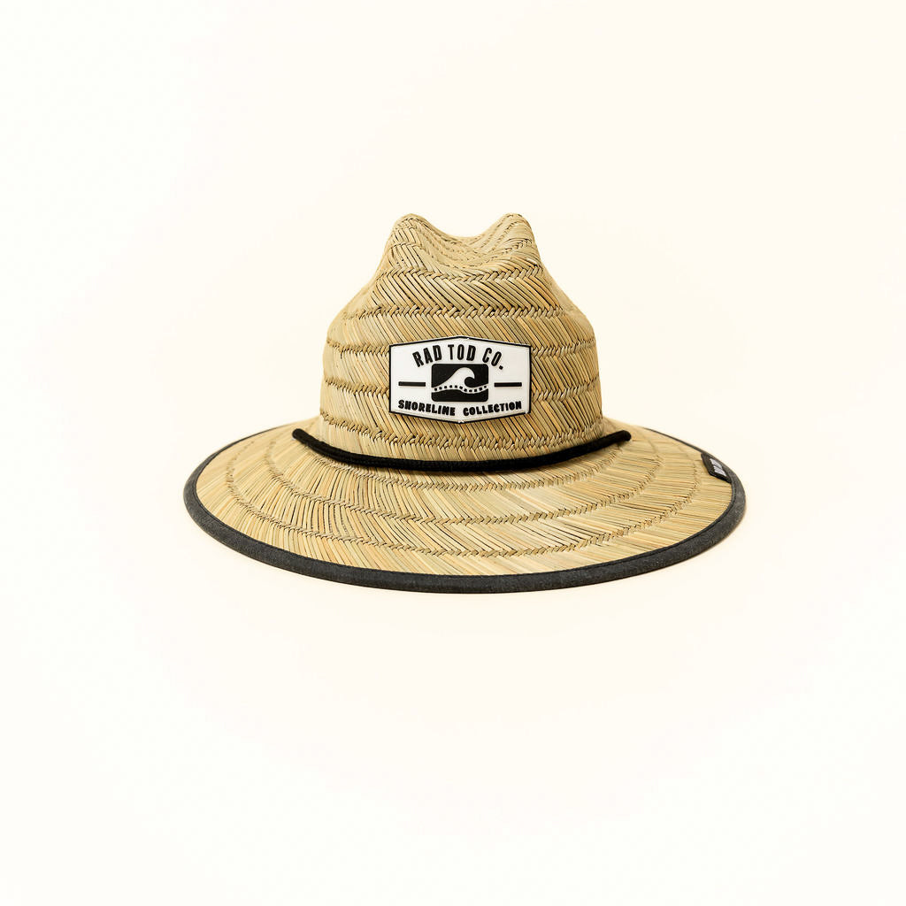 Acid Wash Black straw hat with classic straw exterior and black acid wash detail under the brim, wide brim providing sun protection for face, ears, and neck.