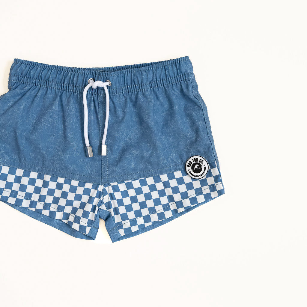 Blue shorts with a checkered pattern on a white background by rad toddler