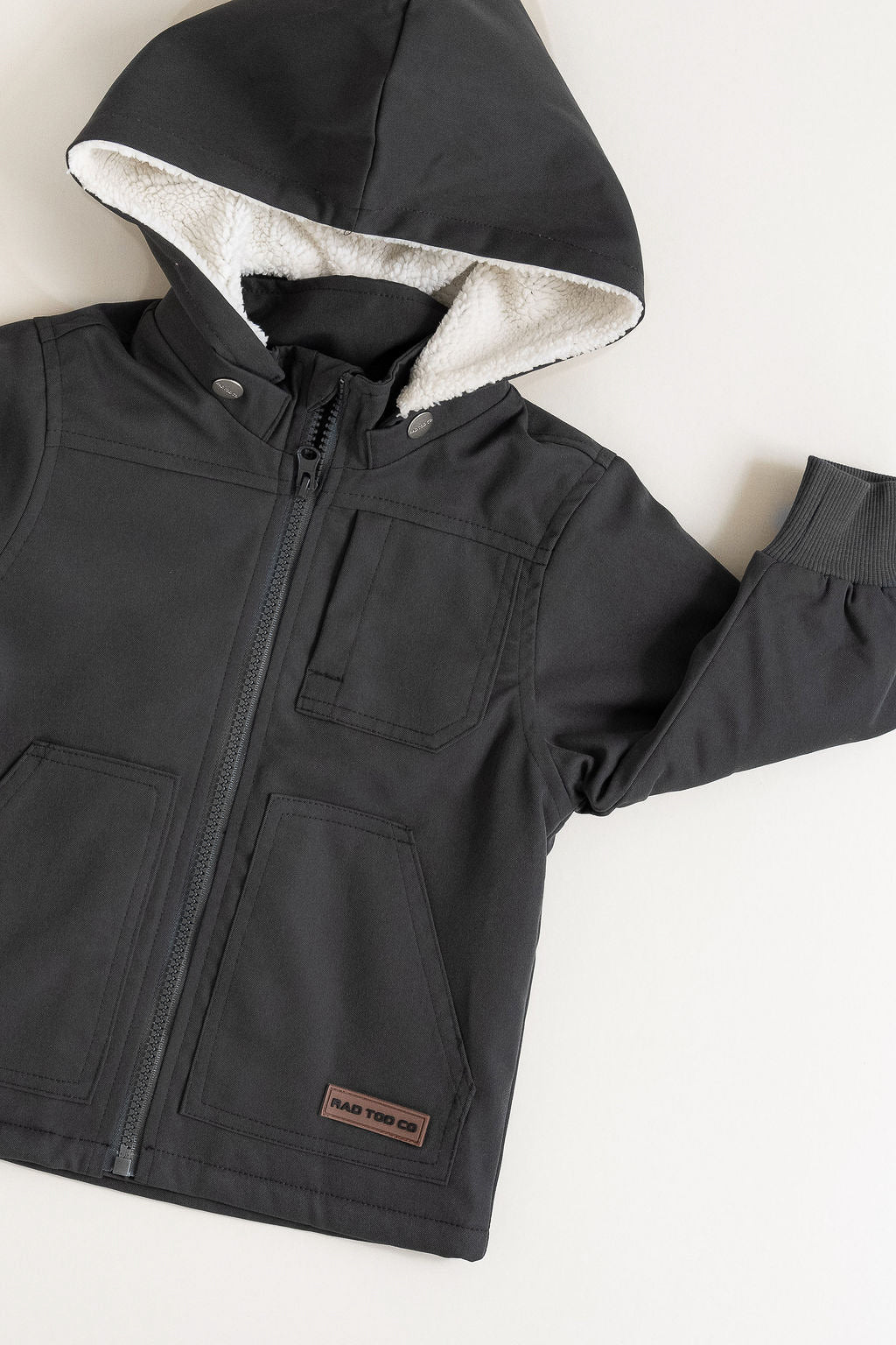 Black jacket with a hood on a white background