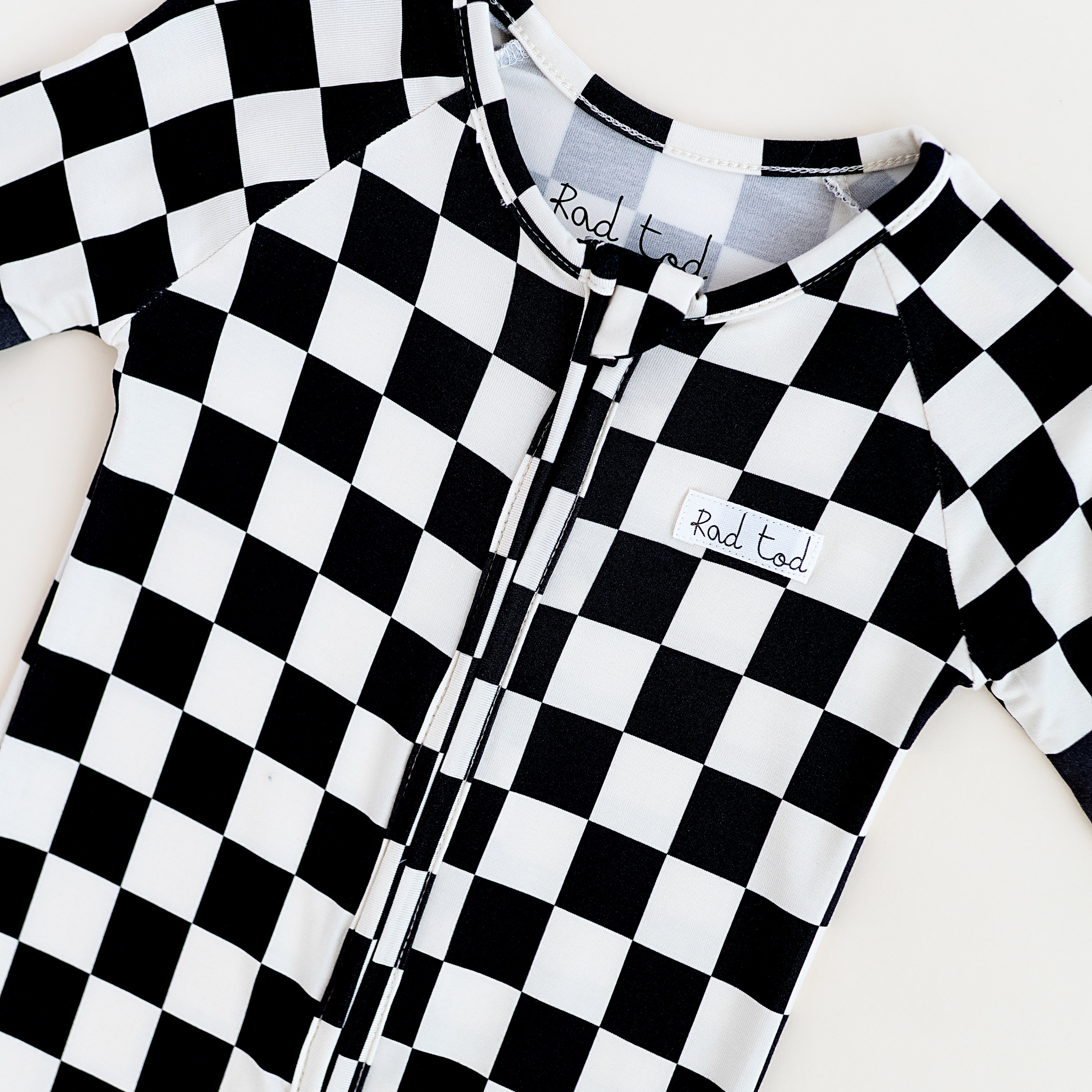 Comfy black and white bamboo checkered onesie for toddlers