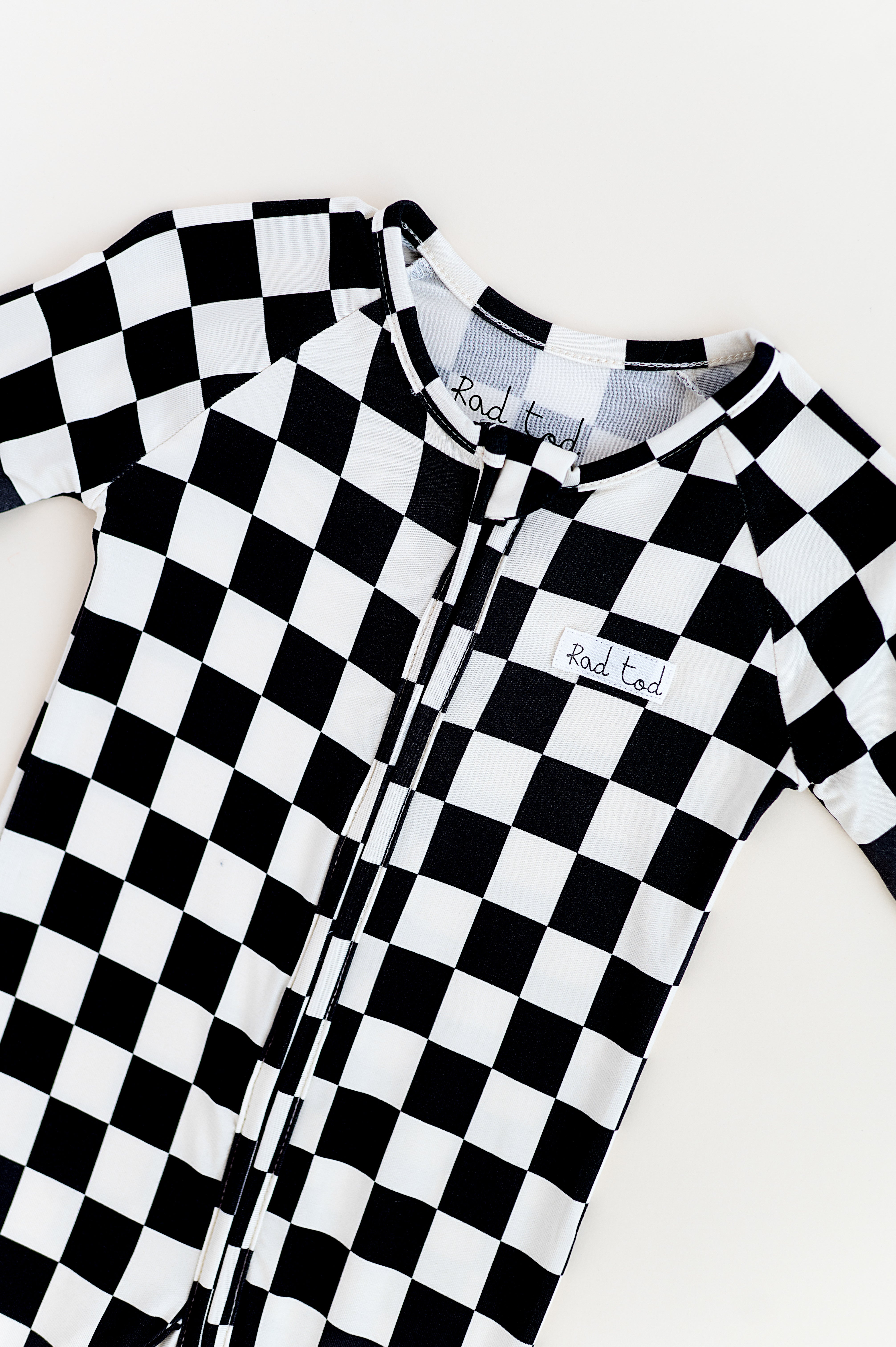 Comfy black and white bamboo checkered onesie for toddlers