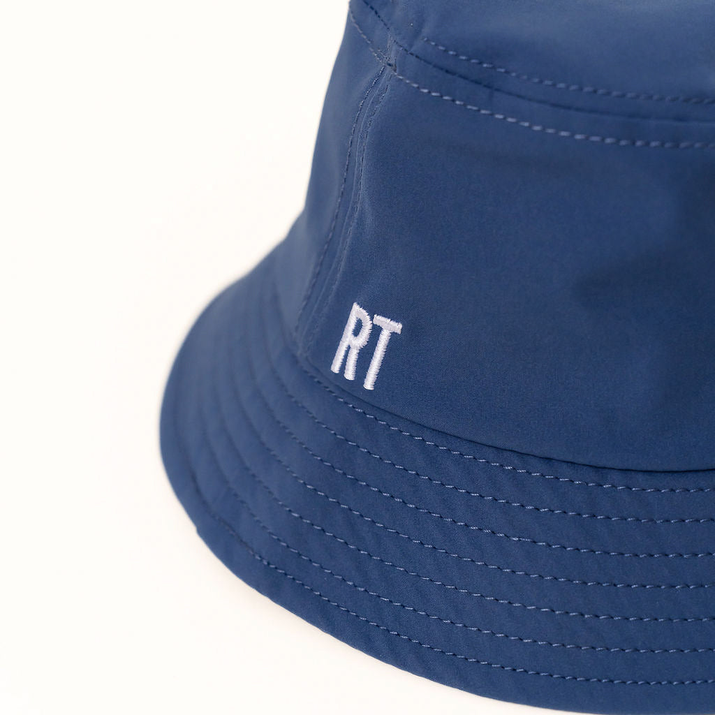Blue bucket hat with 'RT' logo on a white background