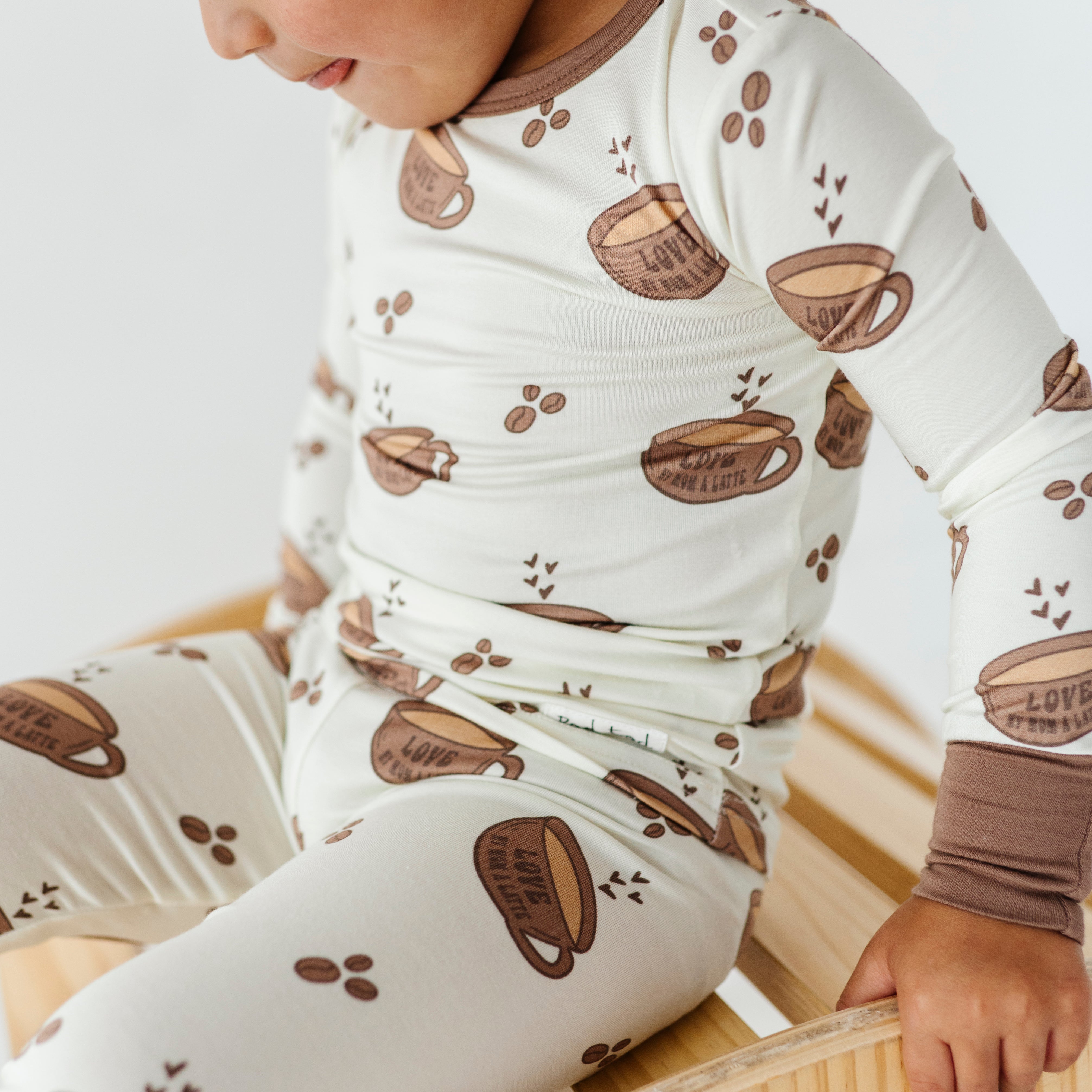 boy wearing Love My Mom Latte Bamboo Pajamas featuring soft, breathable fabric and a playful design for ultimate comfort and style at bedtime