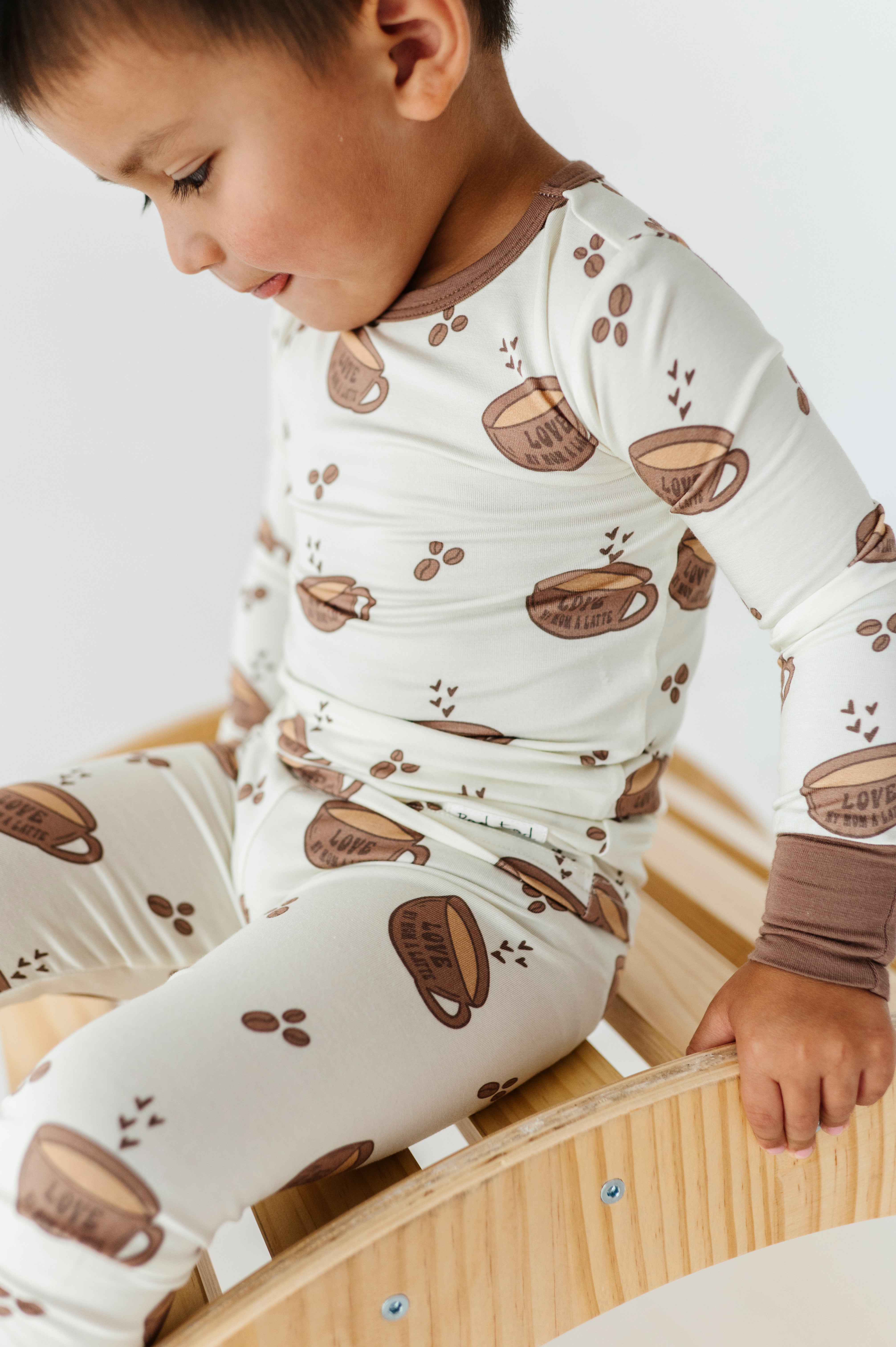 boy wearing Love My Mom Latte Bamboo Pajamas featuring soft, breathable fabric and a playful design for ultimate comfort and style at bedtime