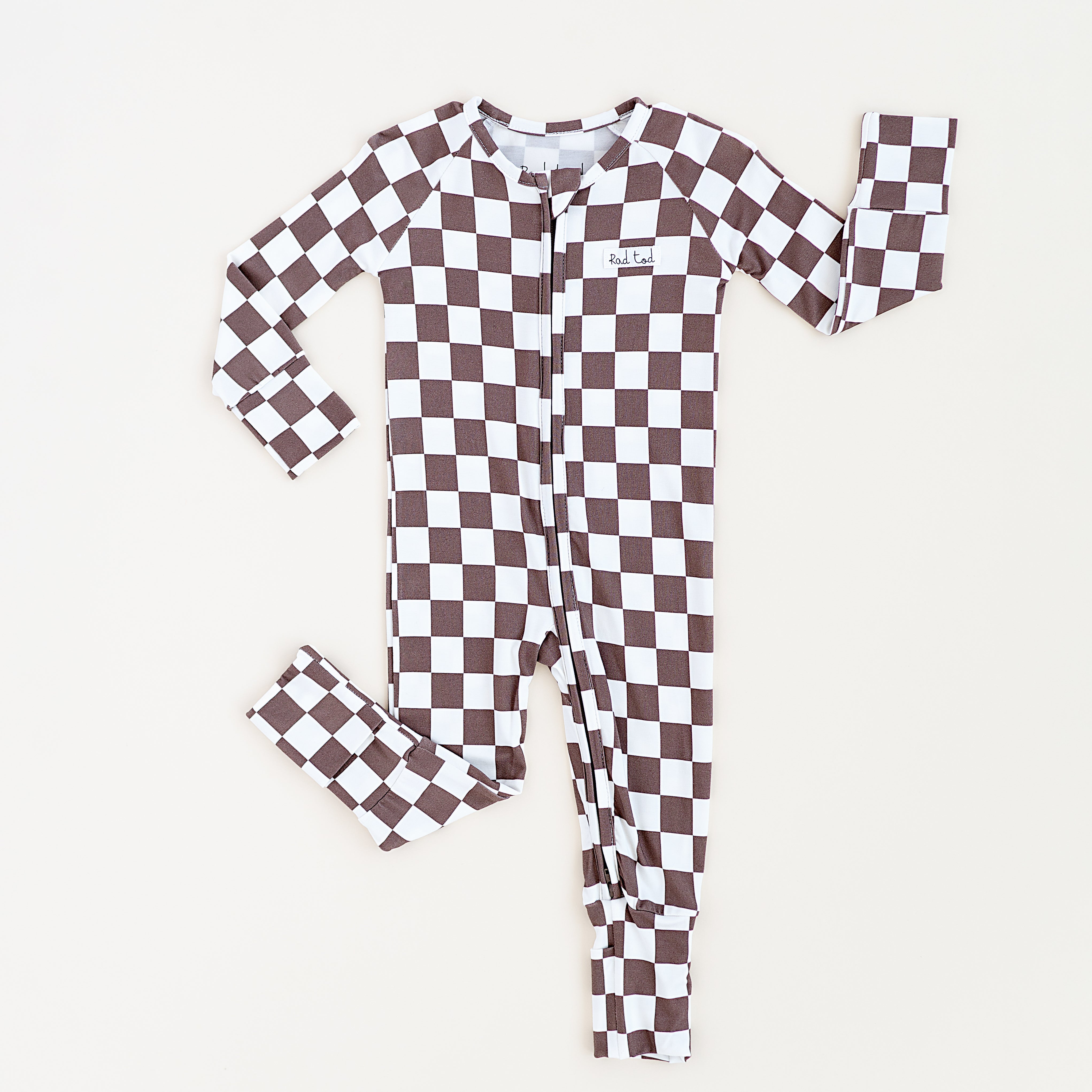 Long sleeve bronze and white checkered bamboo onesie for toddlers, featuring a two-way zipper and foldover footies by Rad Toddler.