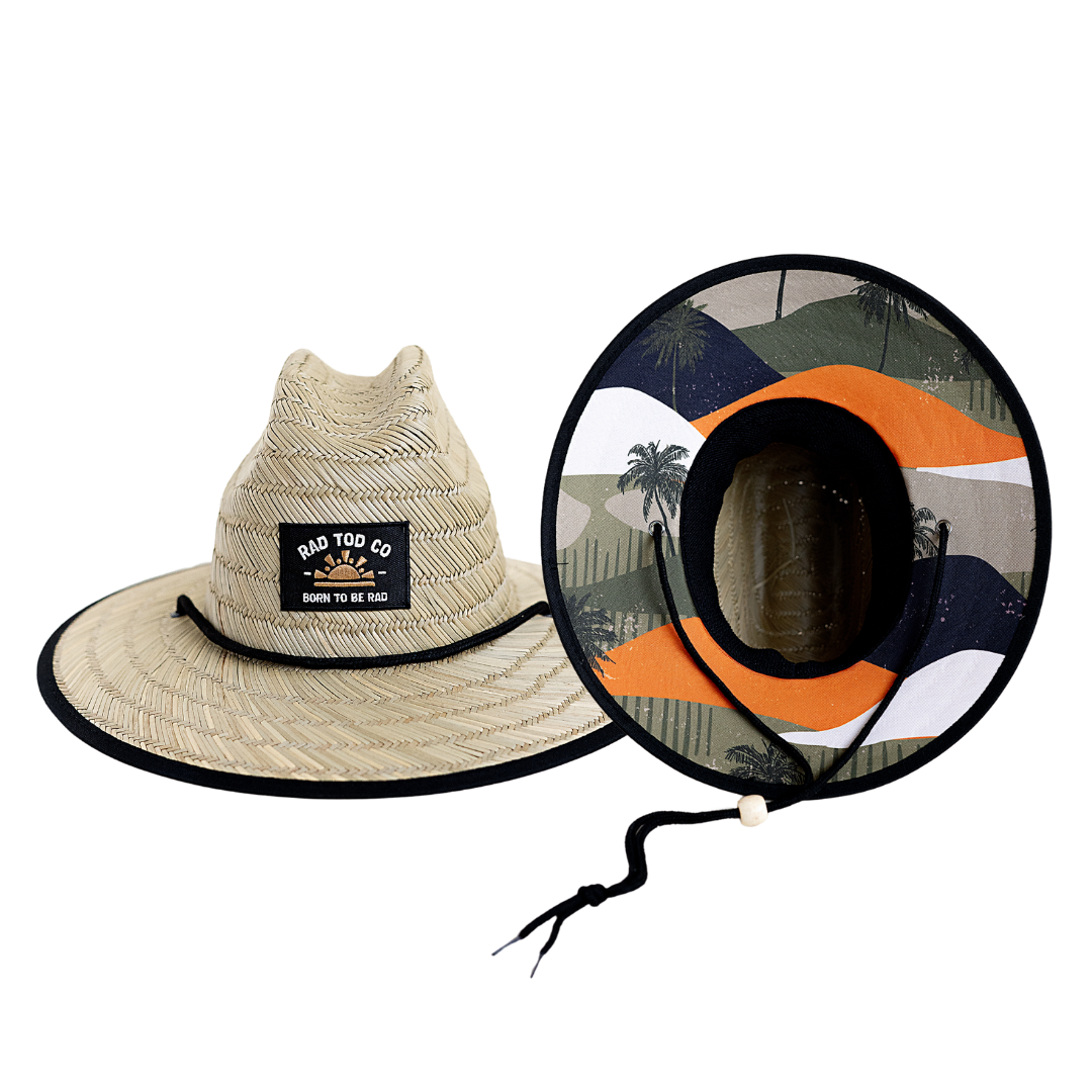 RAD TODDLER straw sun hat with coastal dunes pattern featuring orange, forest green, and black colors with palm trees, designed for toddler sun protection