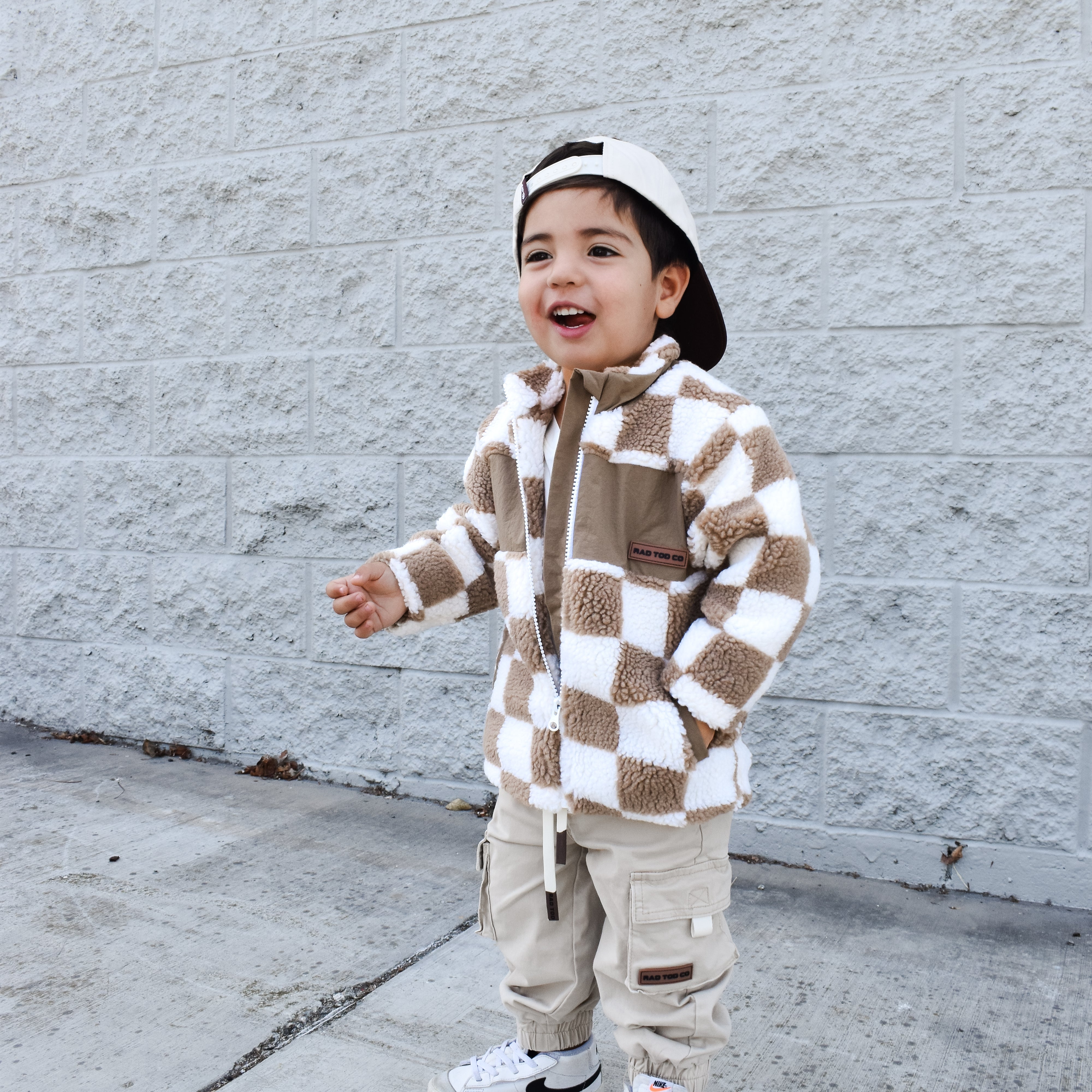 Cozy beige checker sherpa jacket styled for winter