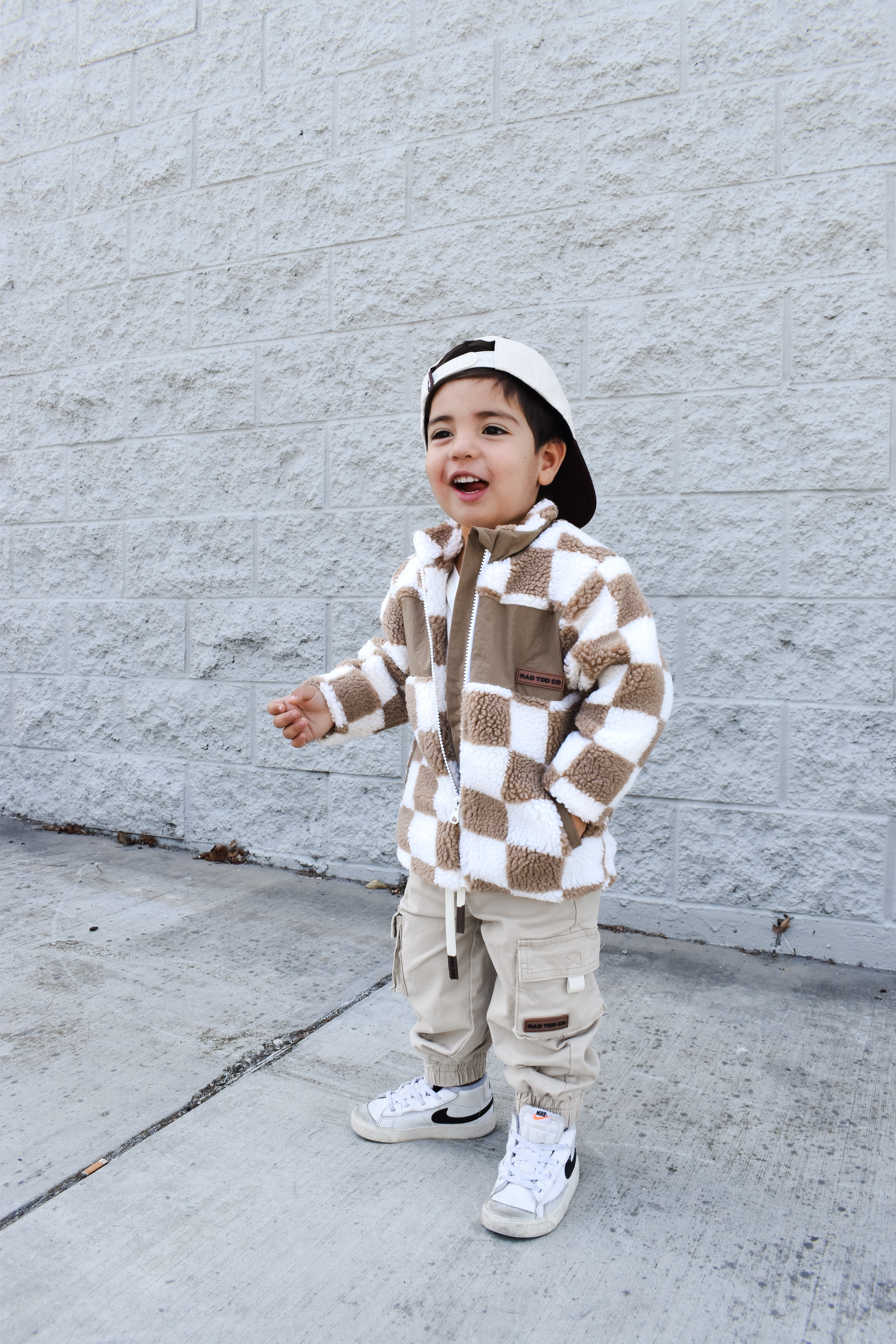 Cozy beige checker sherpa jacket styled for winter
