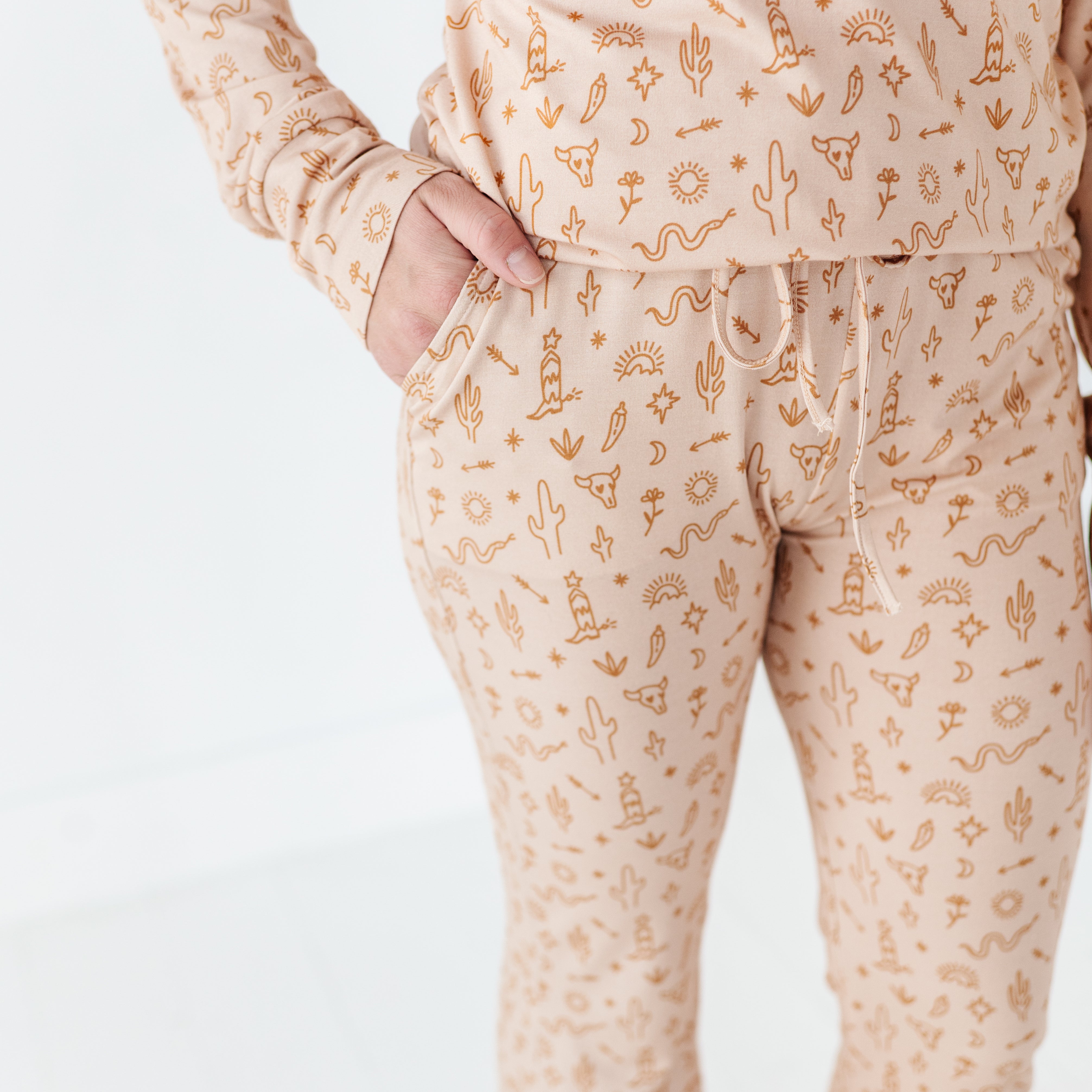 details of the Women’s A Little Bit Country Bamboo Pajamas, designed by a mom, feature a desert-inspired design for ultimate comfort. Perfectly matching with your baby’s coordinating set for a stylish, cozy bedtime look.