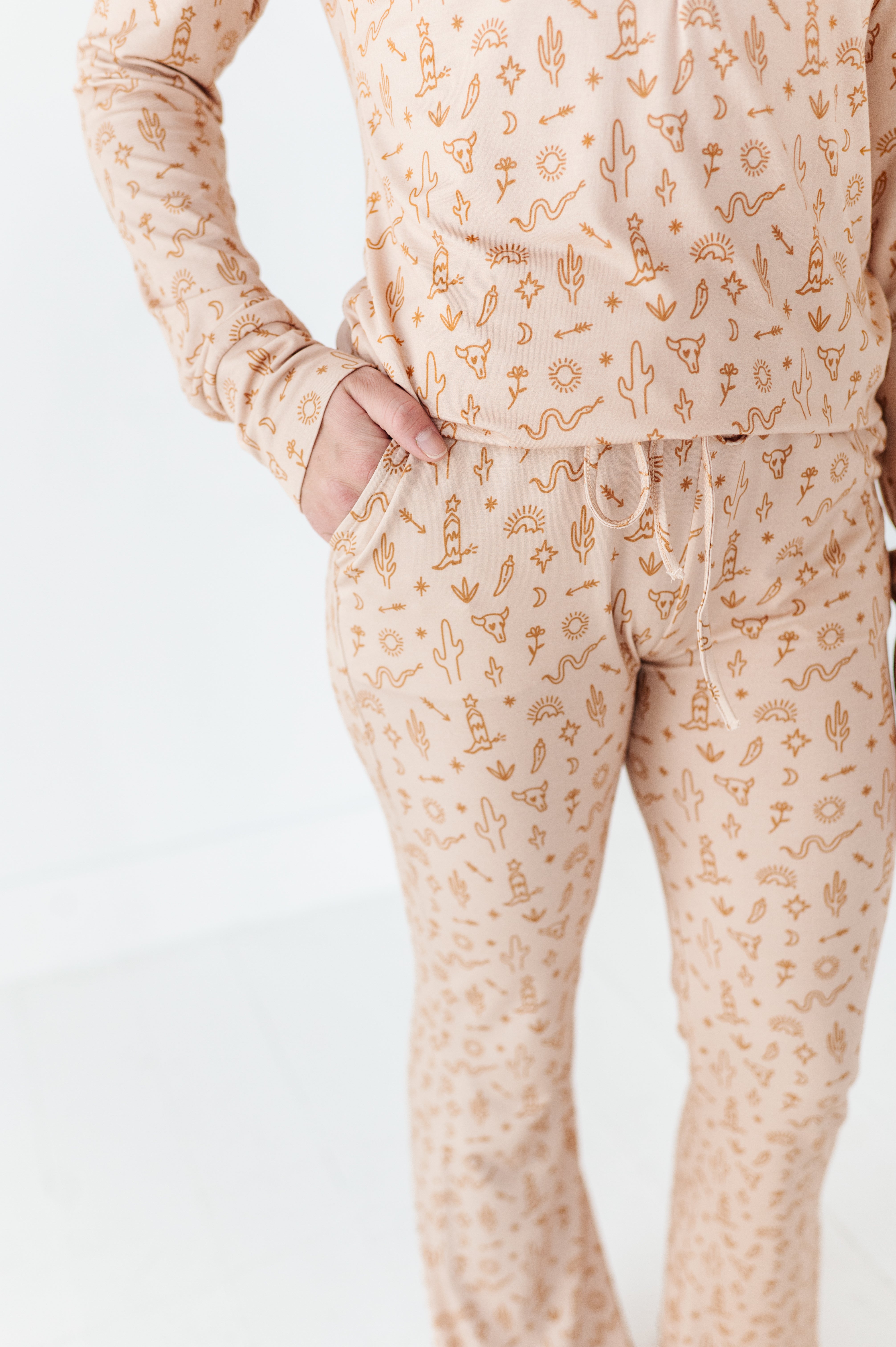 details of the Women’s A Little Bit Country Bamboo Pajamas, designed by a mom, feature a desert-inspired design for ultimate comfort. Perfectly matching with your baby’s coordinating set for a stylish, cozy bedtime look.
