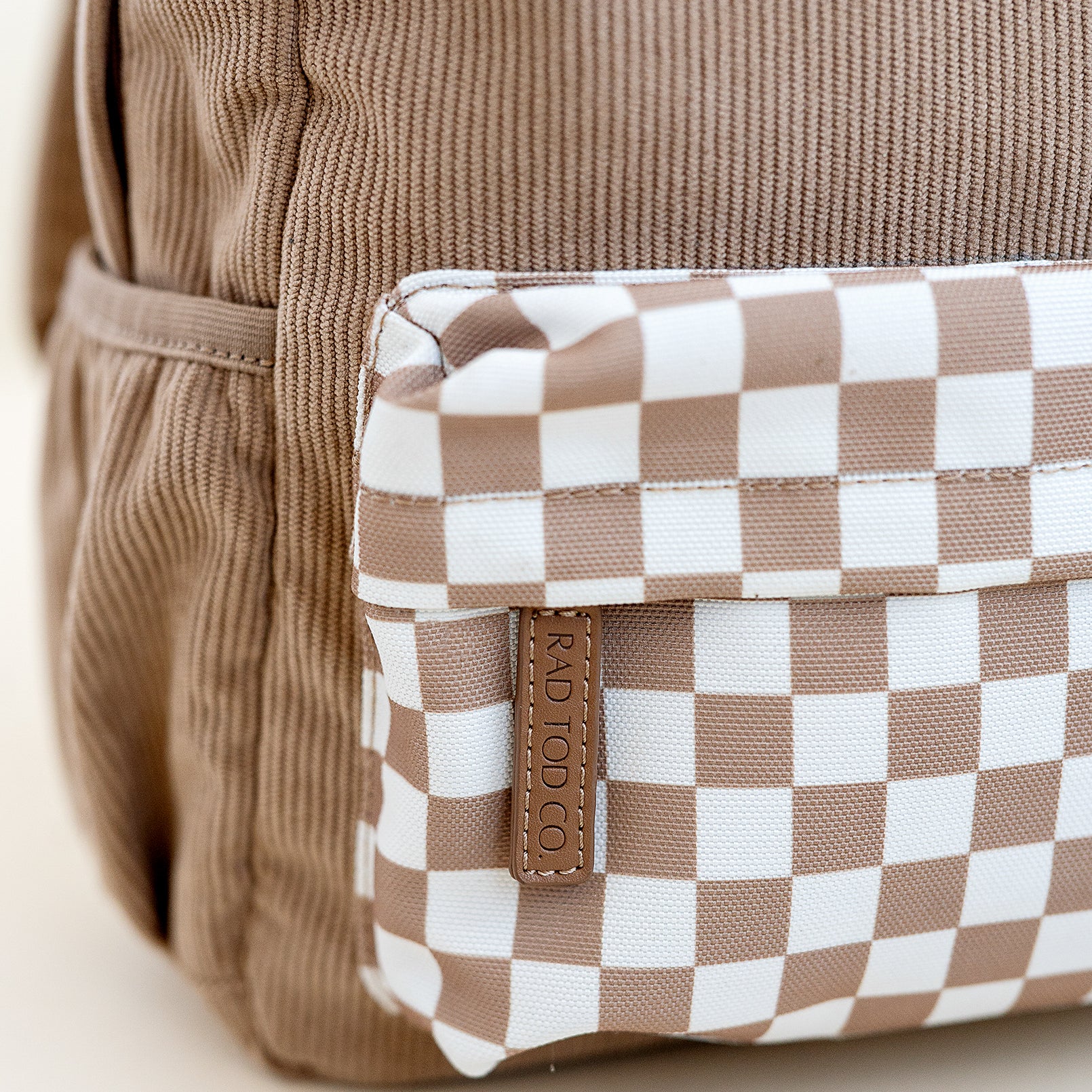 checker pouch on the dune toddler backpack