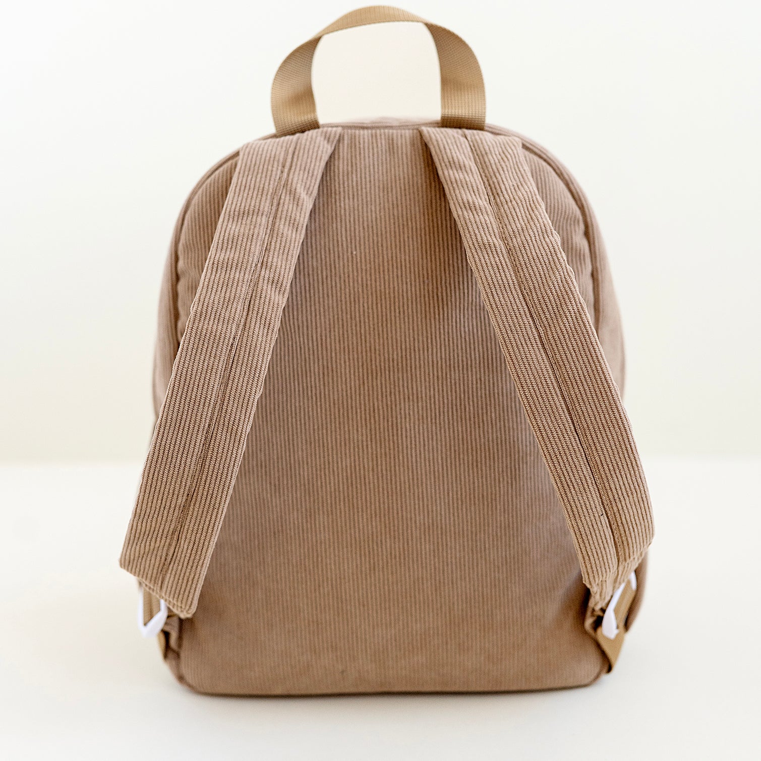 back side of a dune toddler backpack