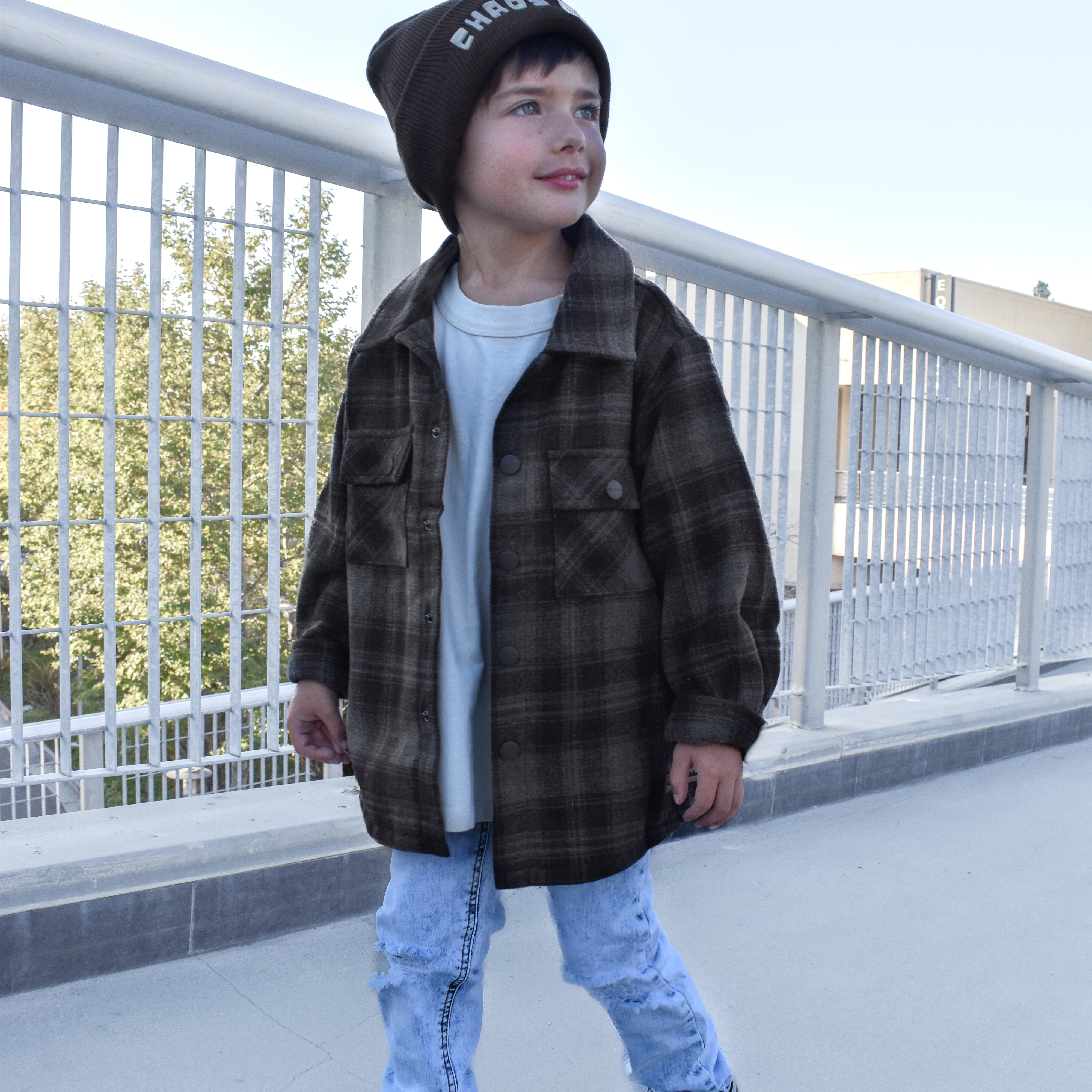 Toddler wearing the Espresso Shacket layered with jeans for a cozy fall look