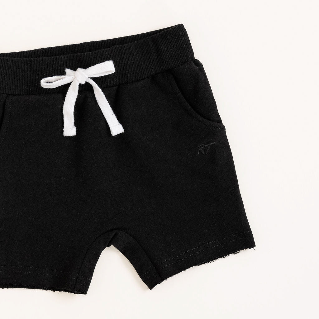 Black shorts with a white drawstring on a white background
