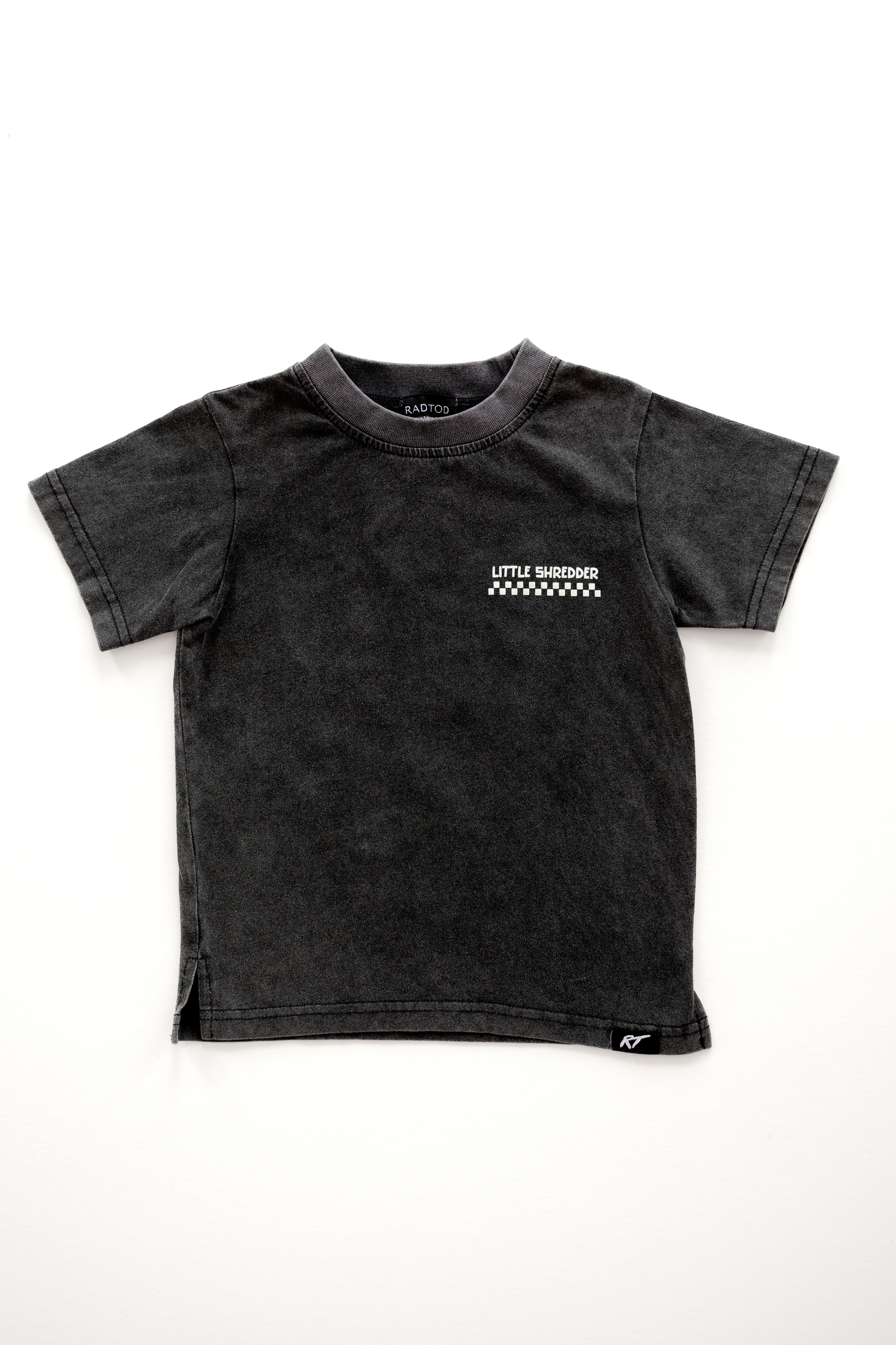 Kids' 'Little Shredder' T-shirt featuring a skeleton surfing a wave design, perfect for young surfers and adventure lovers. this is the front of the shirt