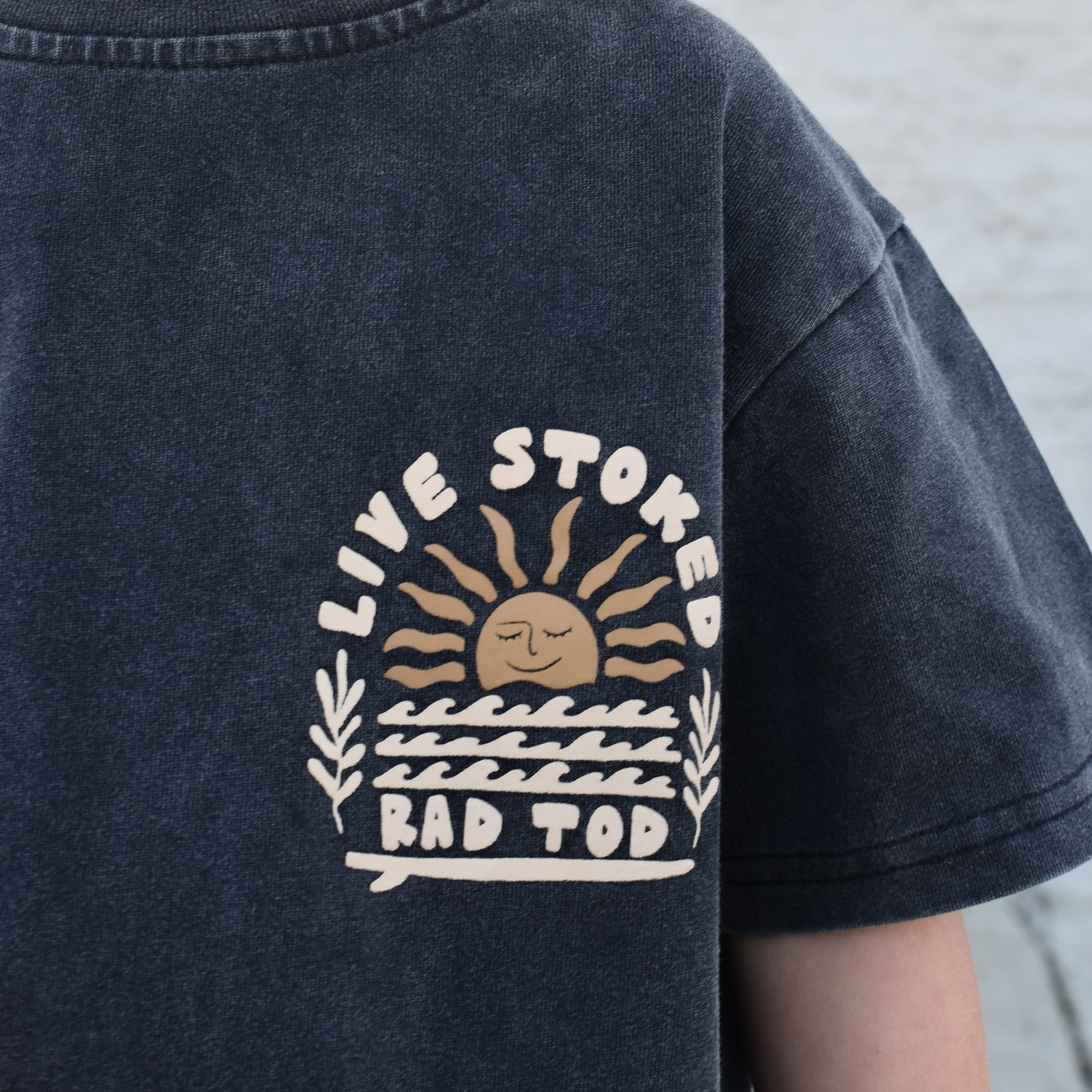 live stoked front side logo, black acid tee