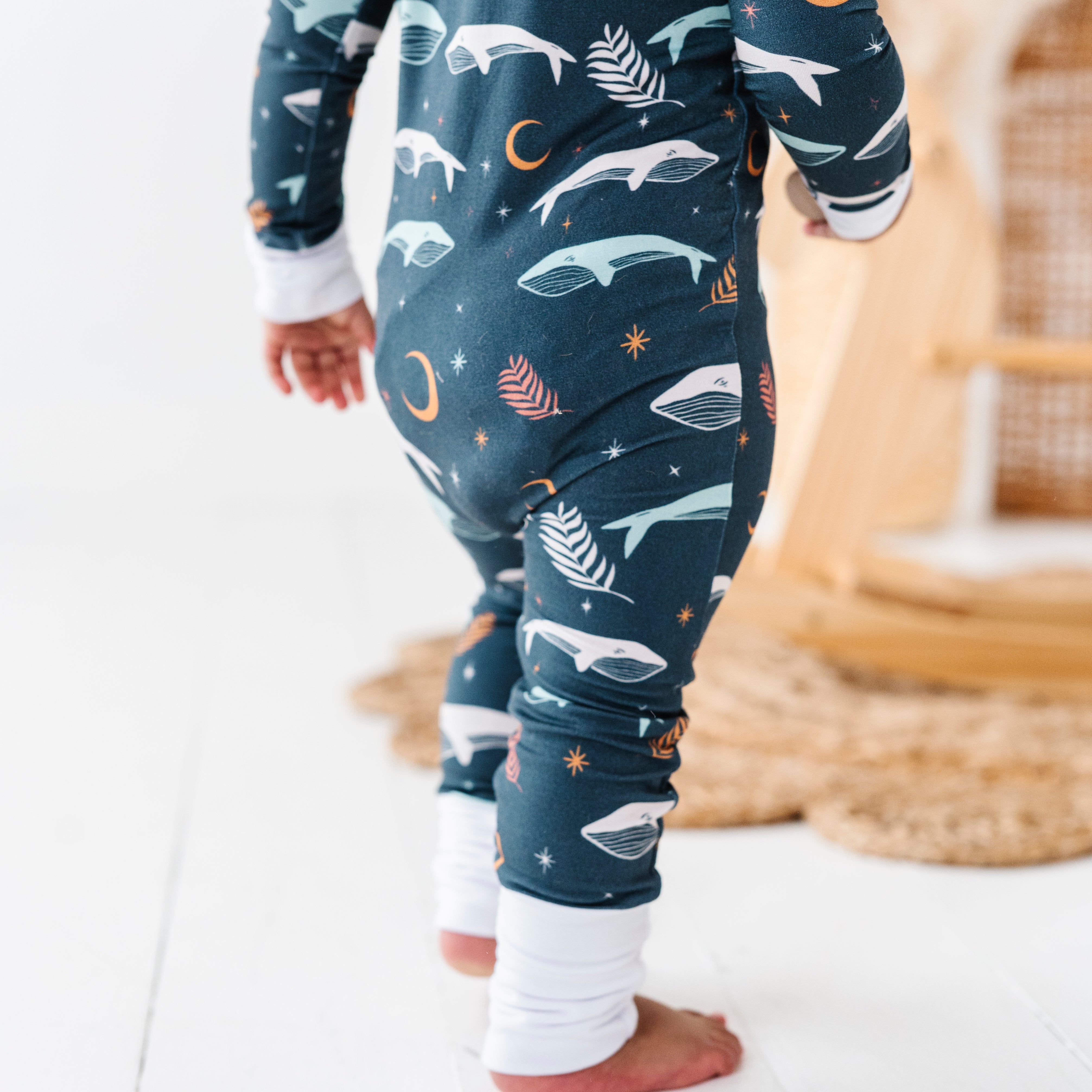 back of Luna Whale Bamboo Onesie featuring soft, breathable fabric, hypoallergenic properties, and a cute whale design for ultimate comfort and style.