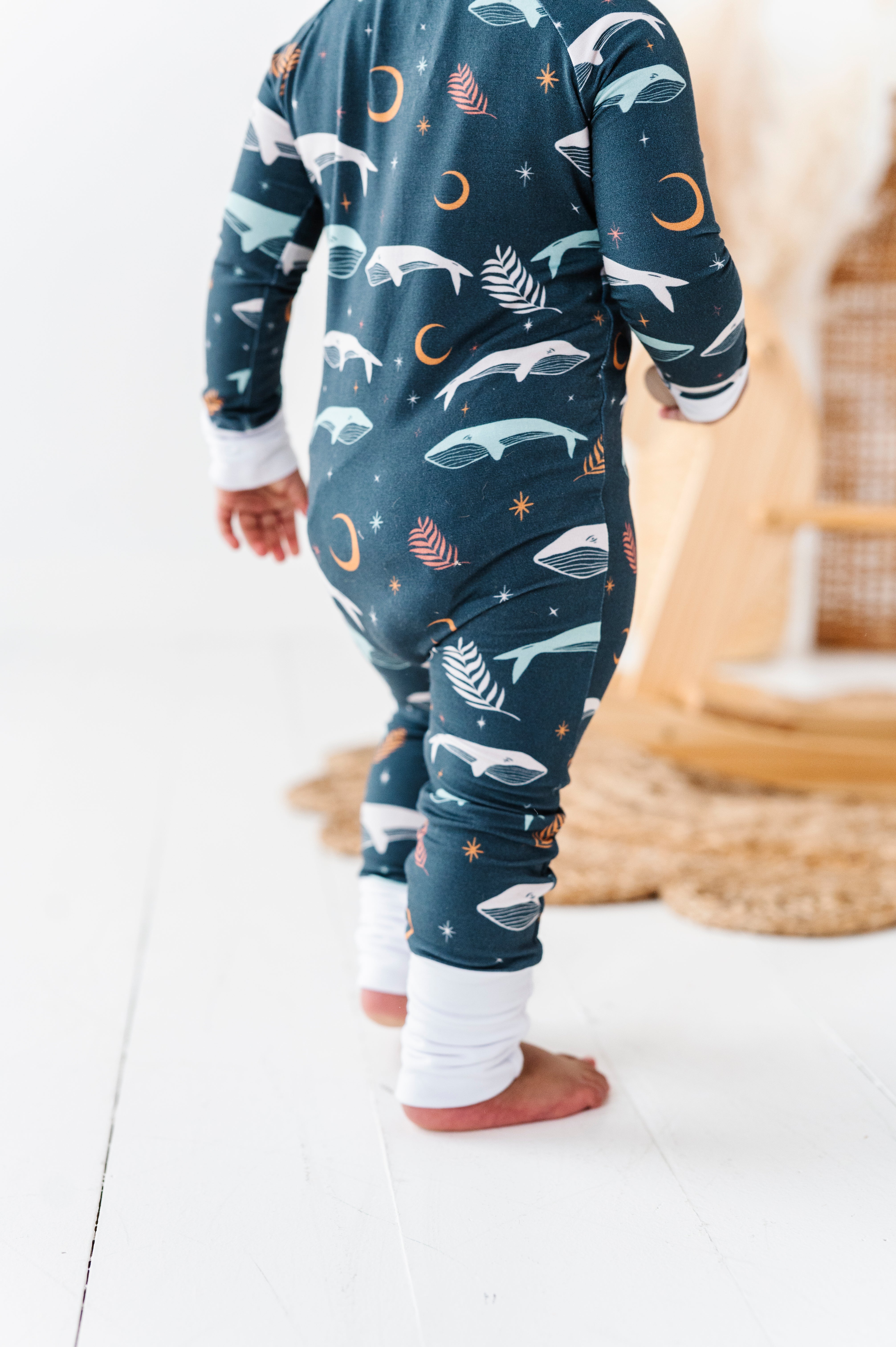 back of Luna Whale Bamboo Onesie featuring soft, breathable fabric, hypoallergenic properties, and a cute whale design for ultimate comfort and style.