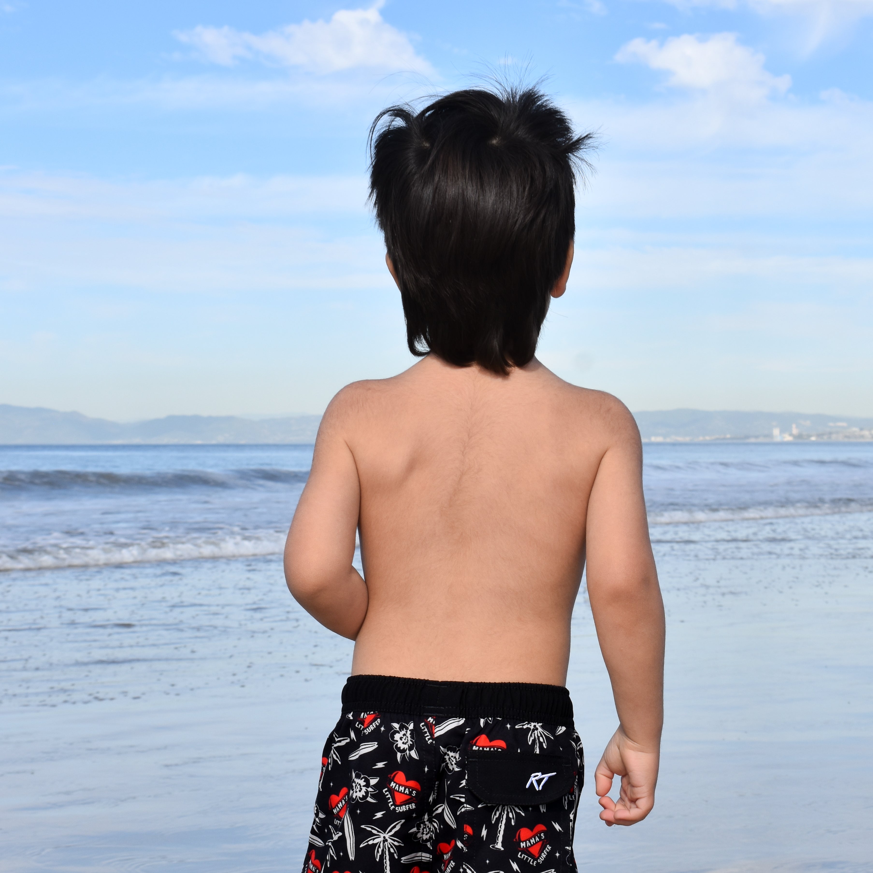 Little surfer wearing Mama’s Little Surfer Swimmie, mom-approved summer outfit