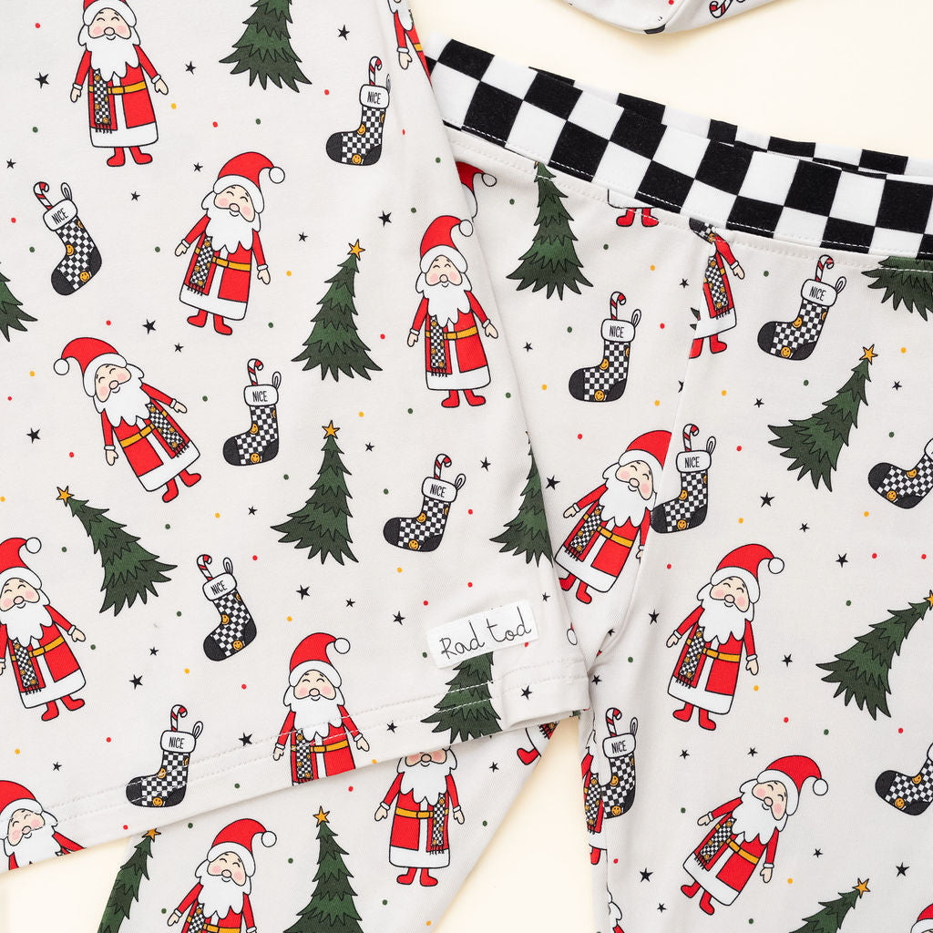 Soft, breathable bamboo pajamas for kids featuring Santa and Christmas trees by Rad Toddler close up