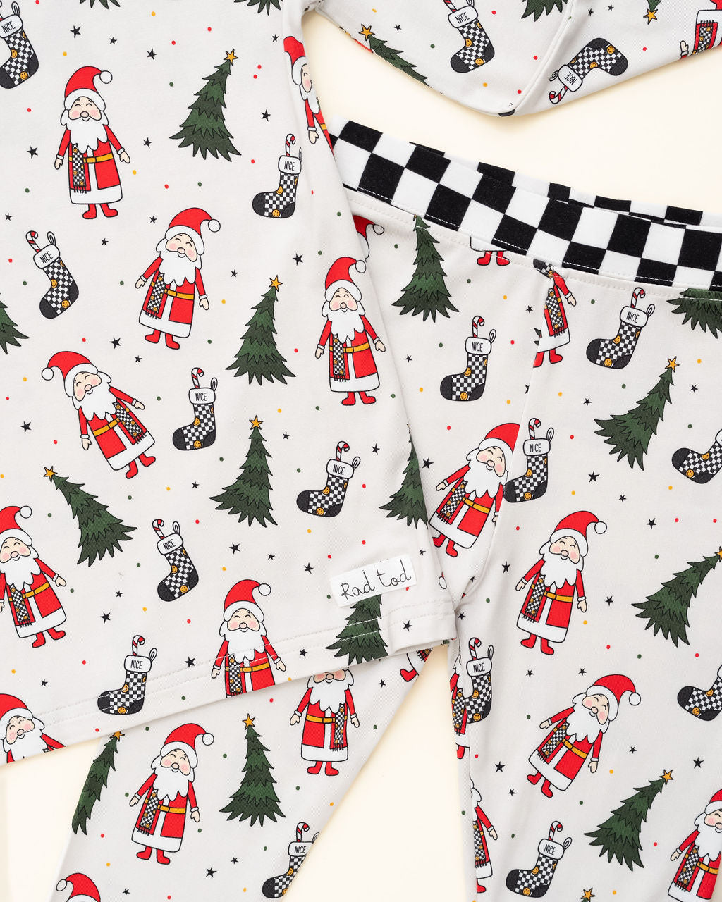 Soft, breathable bamboo pajamas for kids featuring Santa and Christmas trees by Rad Toddler close up