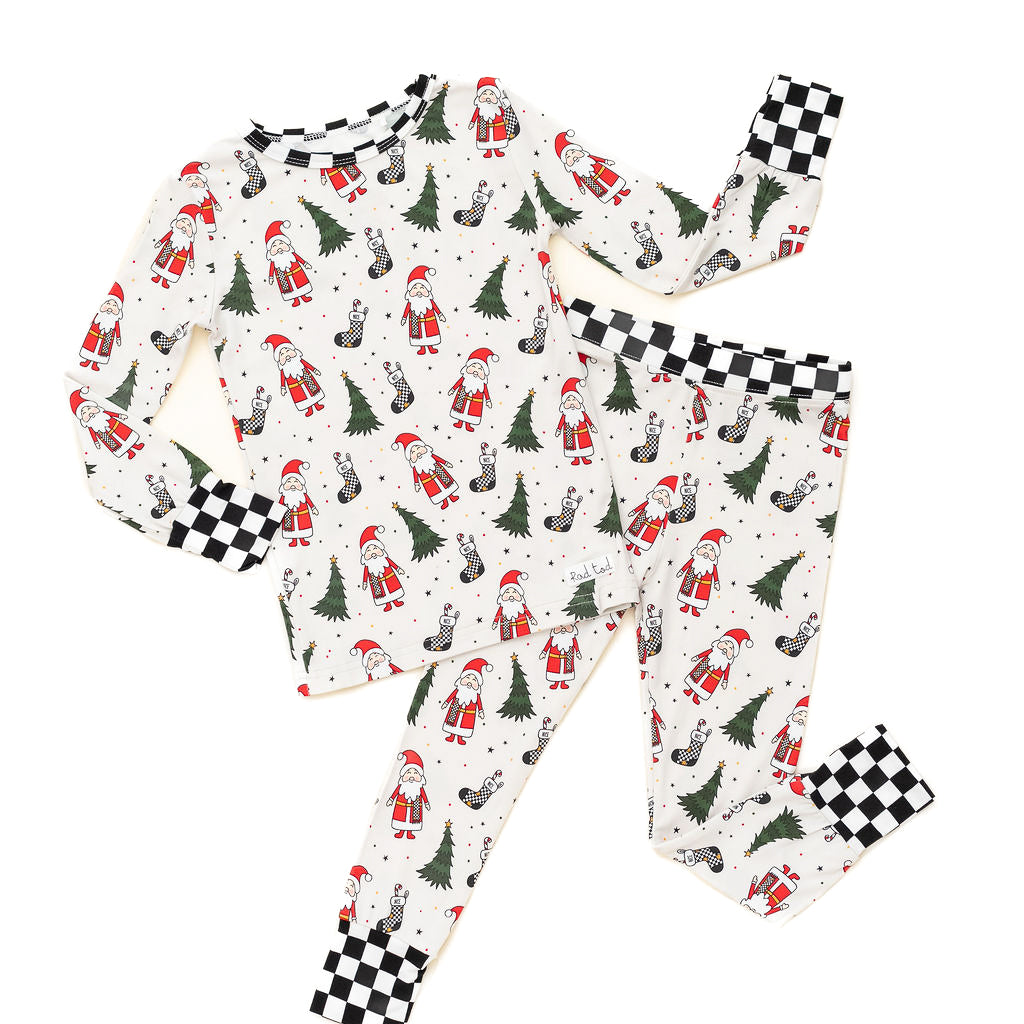 Soft, breathable bamboo pajamas for kids featuring Santa and Christmas trees by RAD TODDLER
