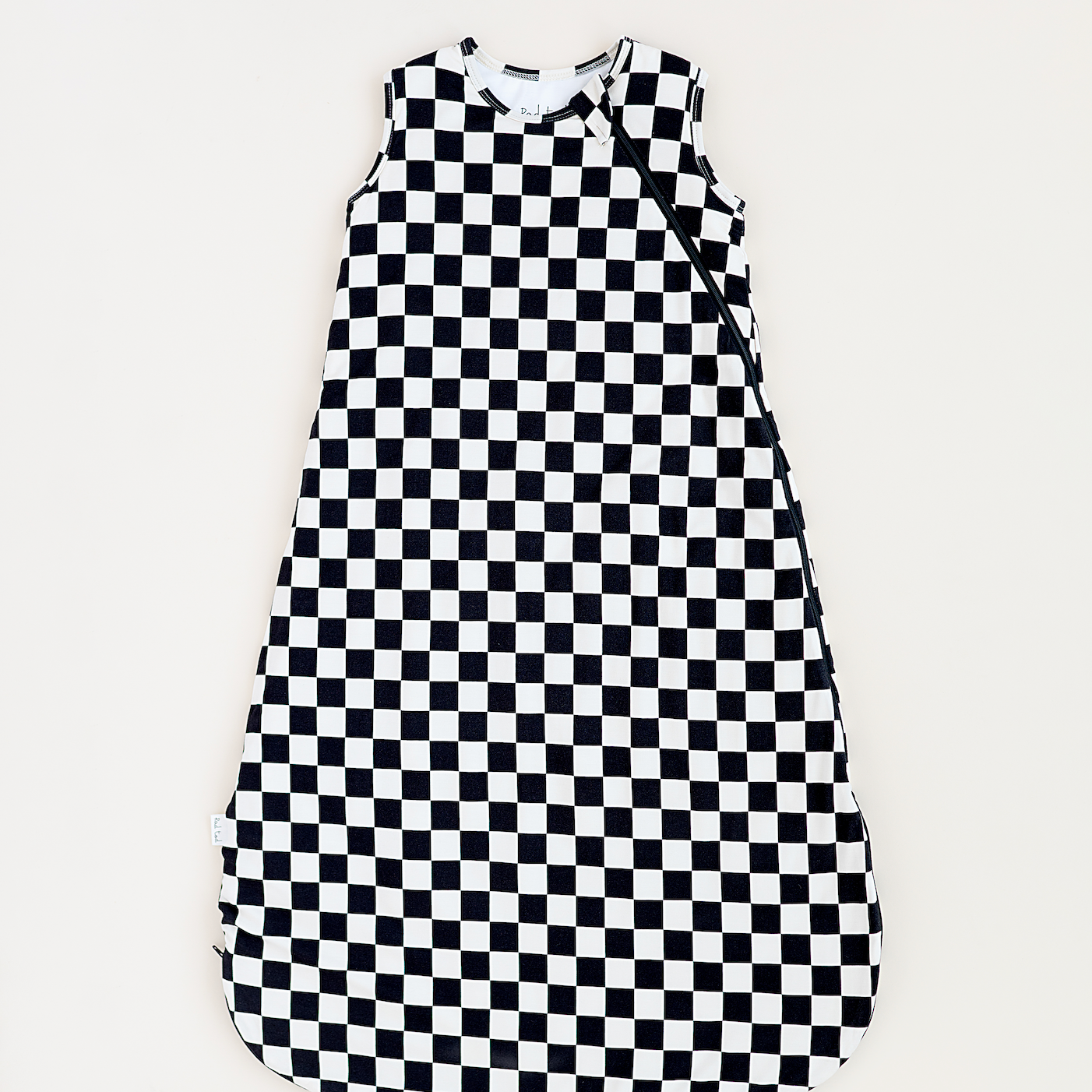 Bamboo sleep bag for toddlers in black and white checkered pattern, featuring a two-way zipper by Rad Toddler.
