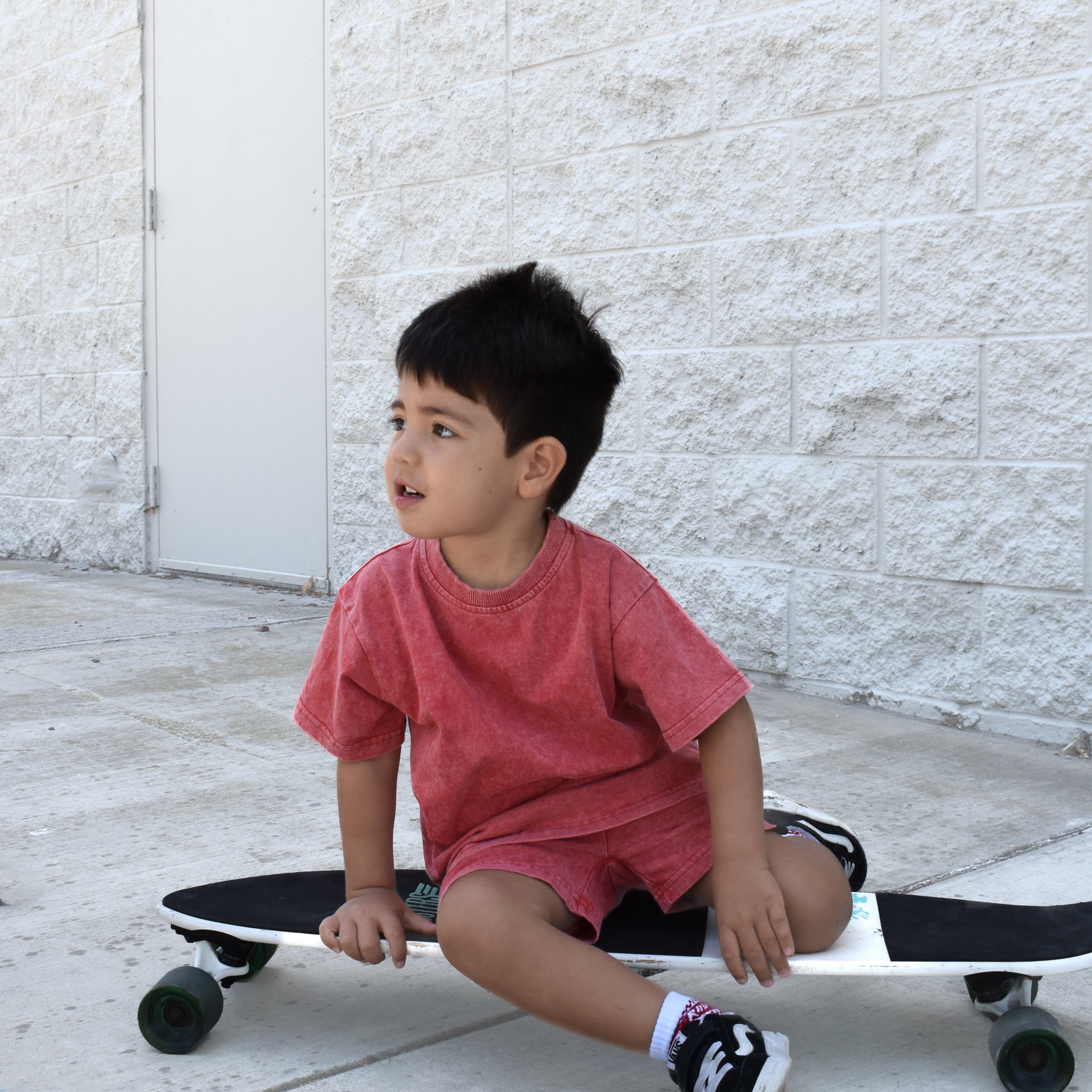 Kids muted red stone wash shorts and tee with vintage washed fabric, elastic waistband, and relaxed everyday fit for comfortable summer wear.