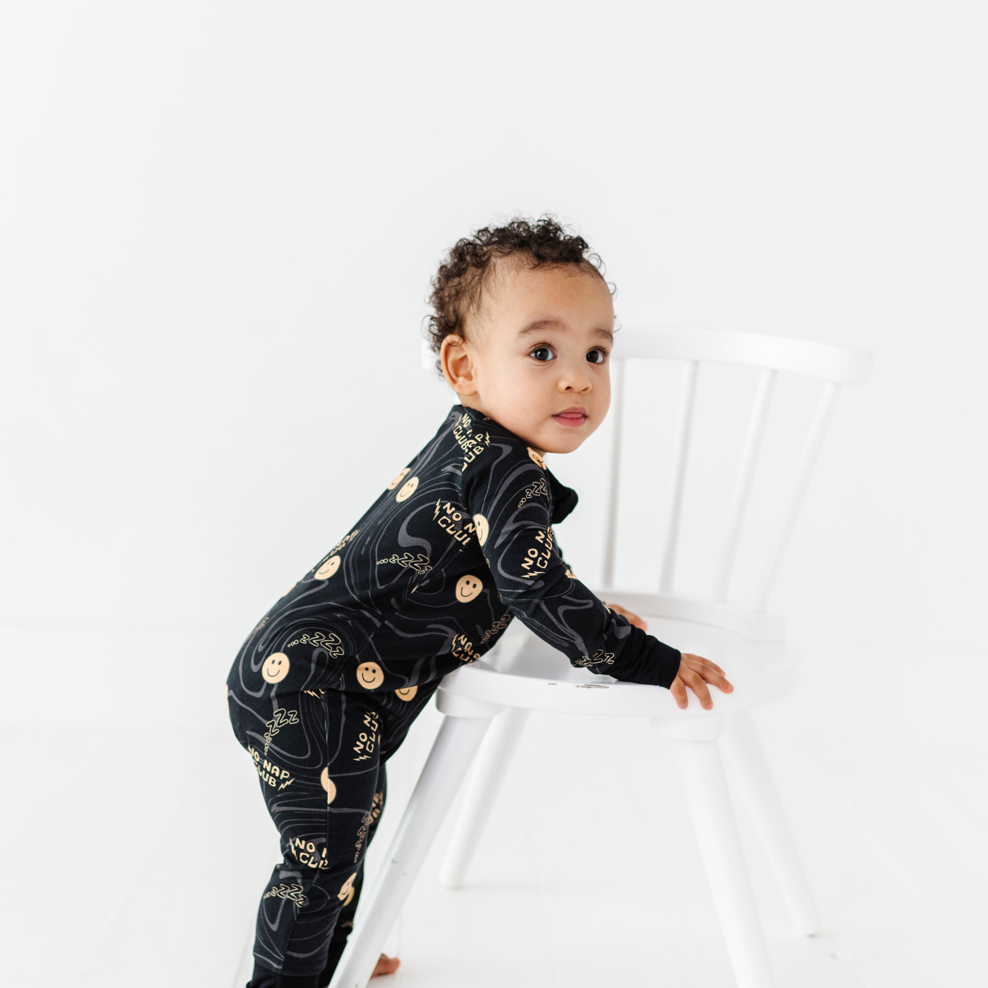 No Nap Club bamboo onesie for toddlers with yellow smiley faces and wavy line pattern