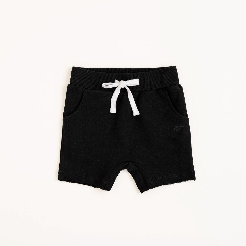 Flat lay of Onyx toddler shorts from the Core Collection with adjustable waistband and front pockets.