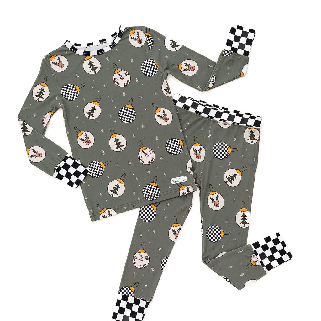 Pine green kids holiday pajamas with festive ornament design