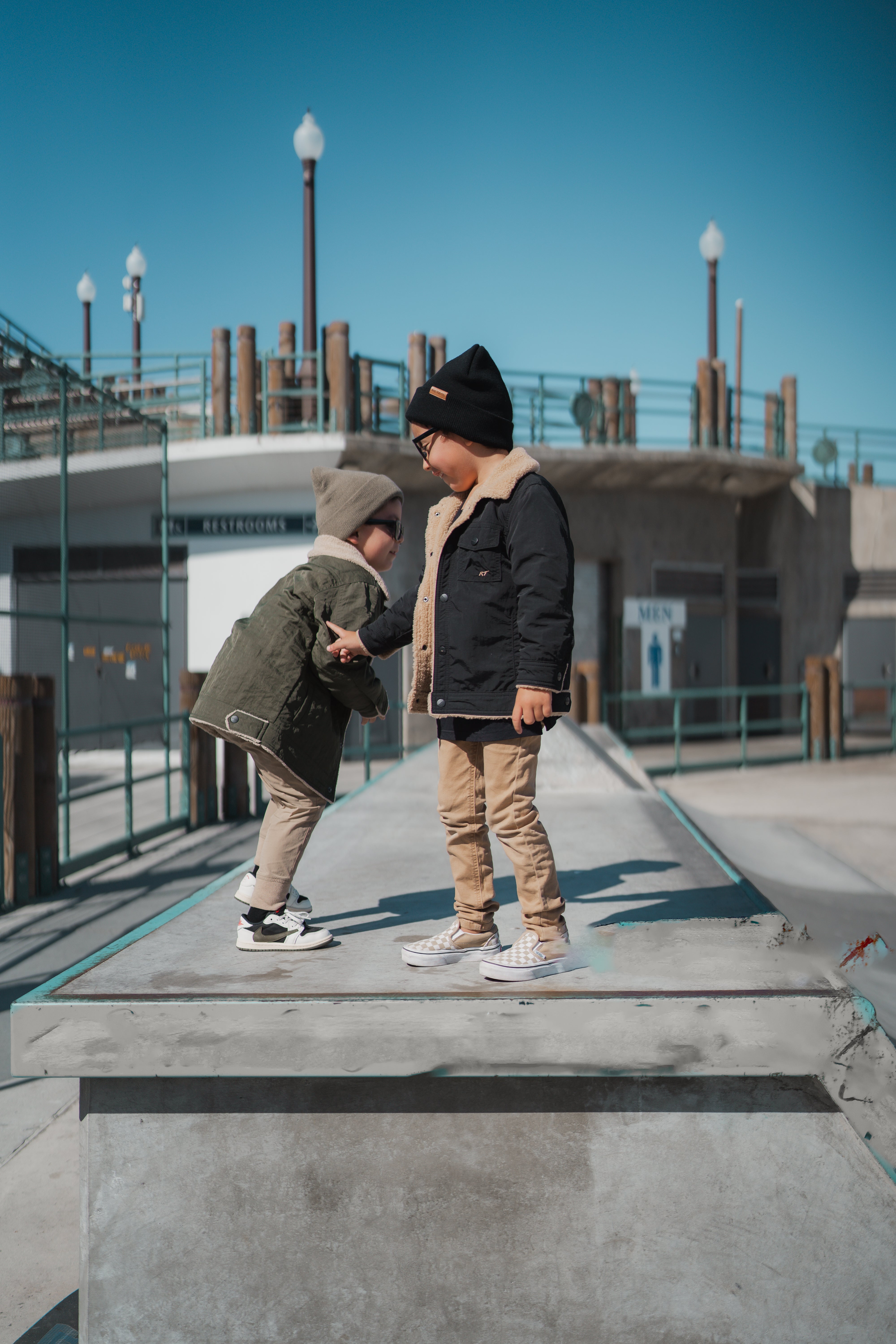RAD TODDLER medium-weight water-resistant jacket with sherpa lining and collar, featuring subtle chest pocket embroidery, shown on toddler model outdoors