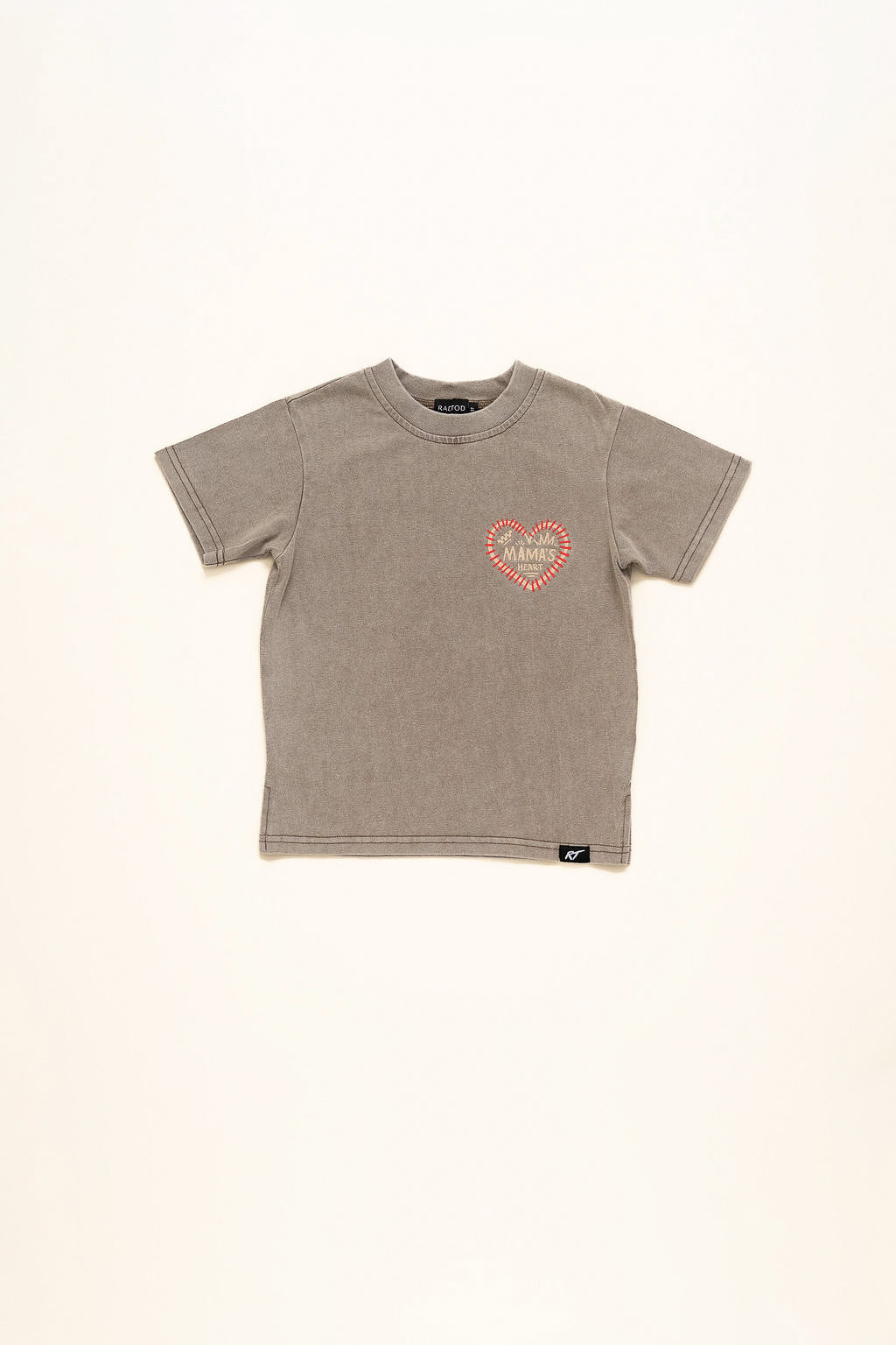 Beige t-shirt with a heart-shaped logo on a beige background