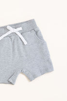 Flat lay of gray toddler shorts from the Core Collection with adjustable waistband and front pockets from the side