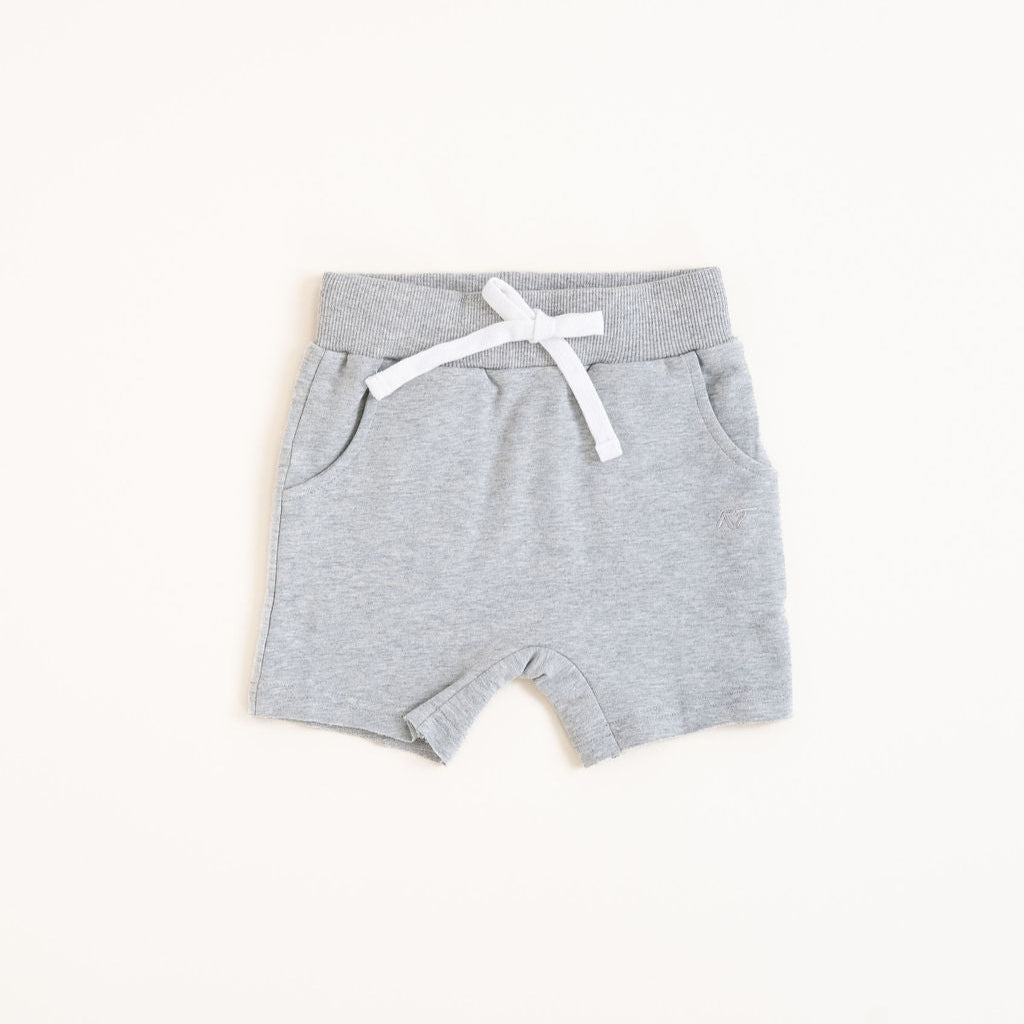 Flat lay of gray toddler shorts from the Core Collection with adjustable waistband and front pockets.